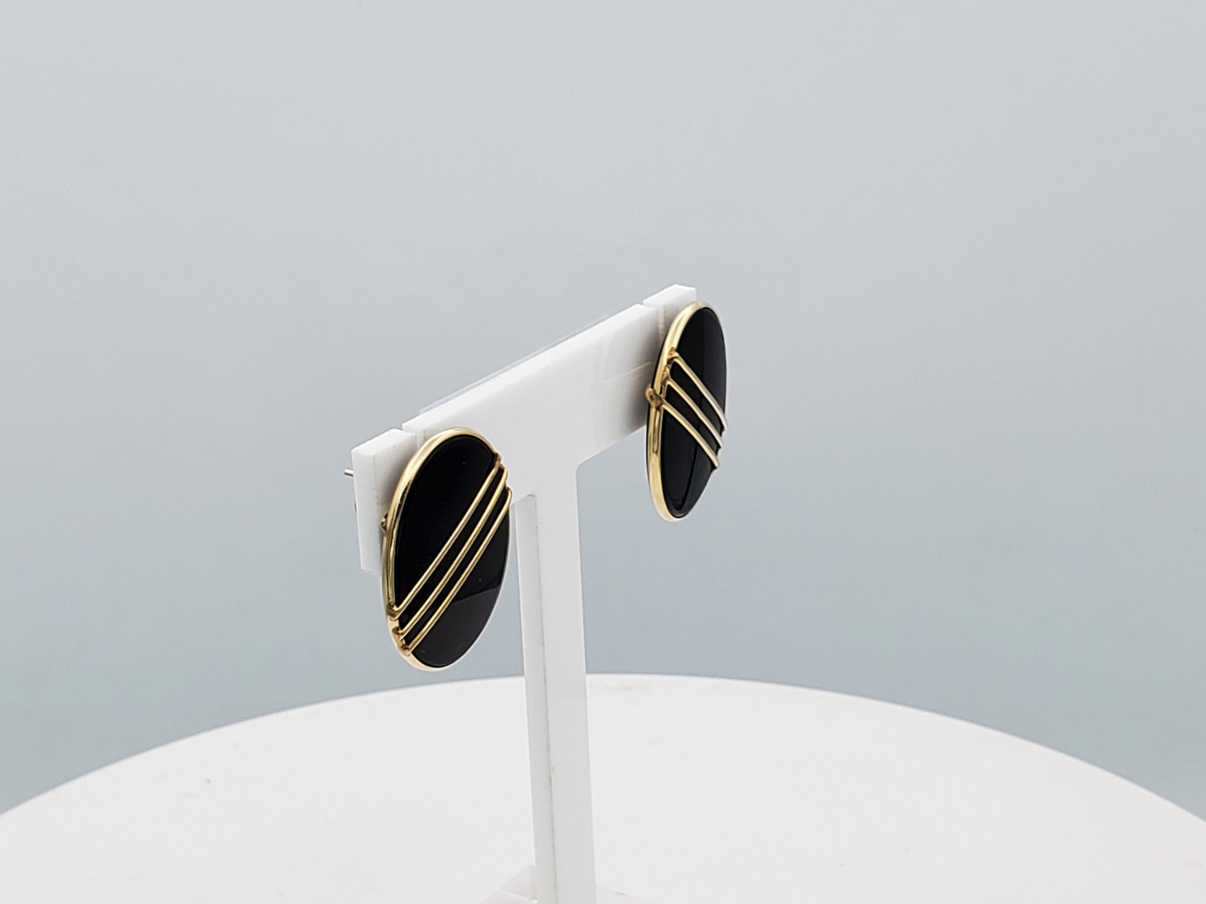 Designer Vintage 14kt Yellow Gold Friction Post Earrings with Black Onyx Inlay, Very Good Condition, 26mm x 19mm x 3.3mm, 7.3 Grams

These earrings are in beautiful condition with a classic design that's timeless. Nice addition to your jewelry