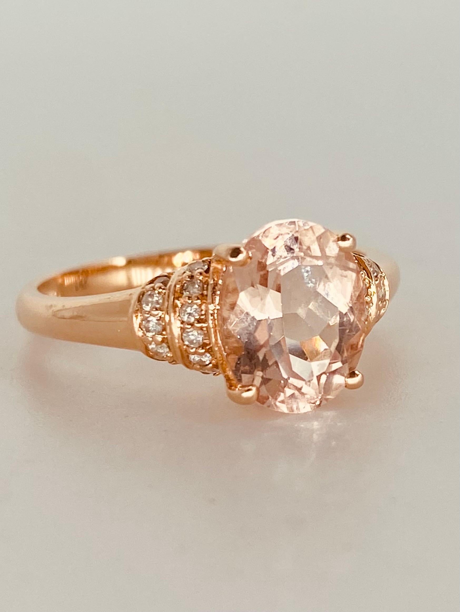 Designer 1.86 Carat Tourmaline & Diamonds Engagement Ring 14k Rose Gold. The ring features center tourmaline gemstone surrounded by approx 0.30 carat white diamonds. The ring is made in 14k solid rose gold and is a size 7 and weights 2.6 grams.