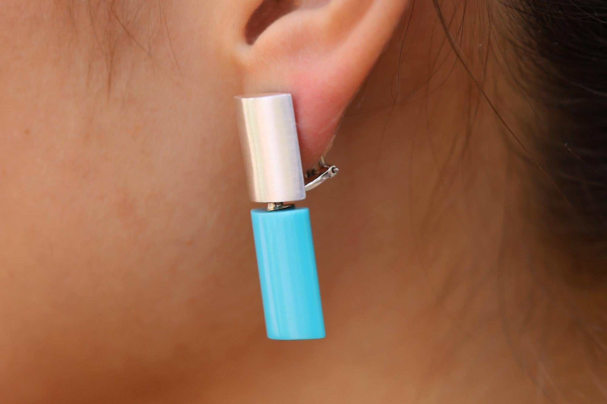 The most chic and versatile gemstone earrings we've come across in our 50 years of treasure hunting. These sleek and stylish earrings start with concave cubes of 18 karat white gold. Start stacking with rich, 18 karat yellow gold cubes or attach