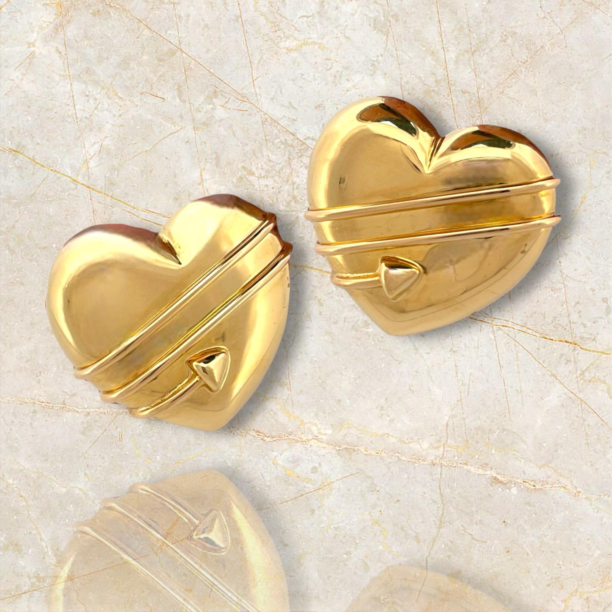 Capture the essence of romance with these Designer 18K Yellow Gold Tiffany & Co. Cupid's Arrow Heart Earrings. Expertly crafted in luxurious yellow gold, each earring features a delicate heart design pierced by Cupid's arrow, symbolizing love and