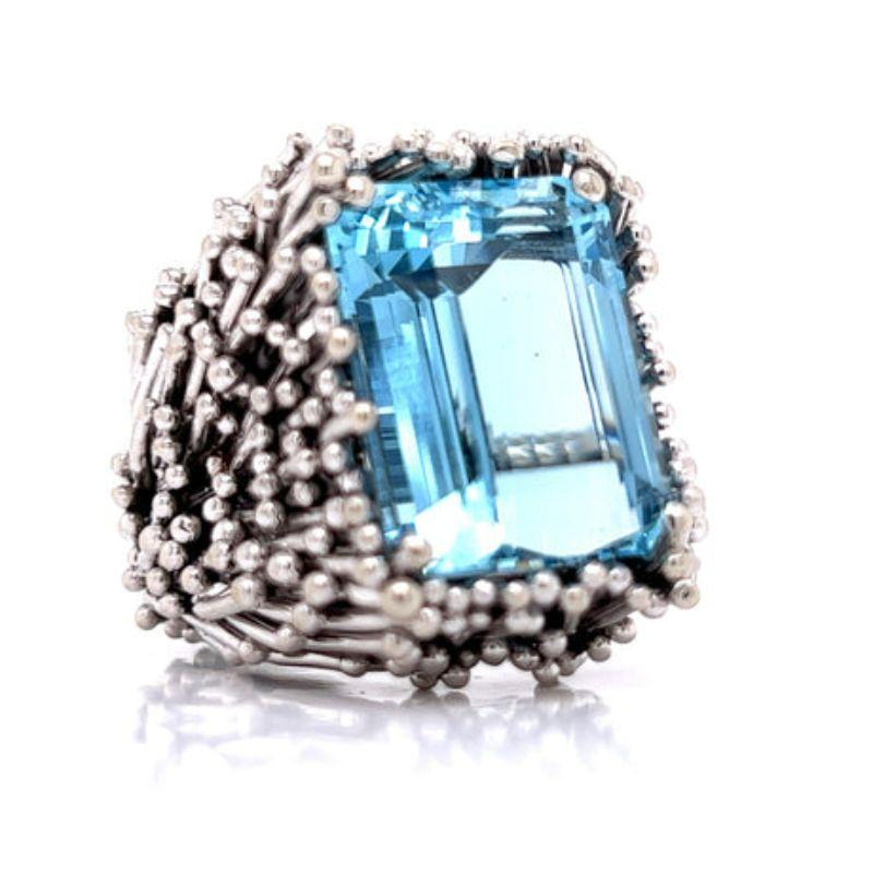 Designer 20.20 Carat Aquamarine Estate Ring

This one of a kind ring is sure to make you stand out in a crowd! The emerald shaped aquamarine gemstone is 20.20 carats, encompassed by 30 grams of 18 K white gold. This ring was custom made in the style