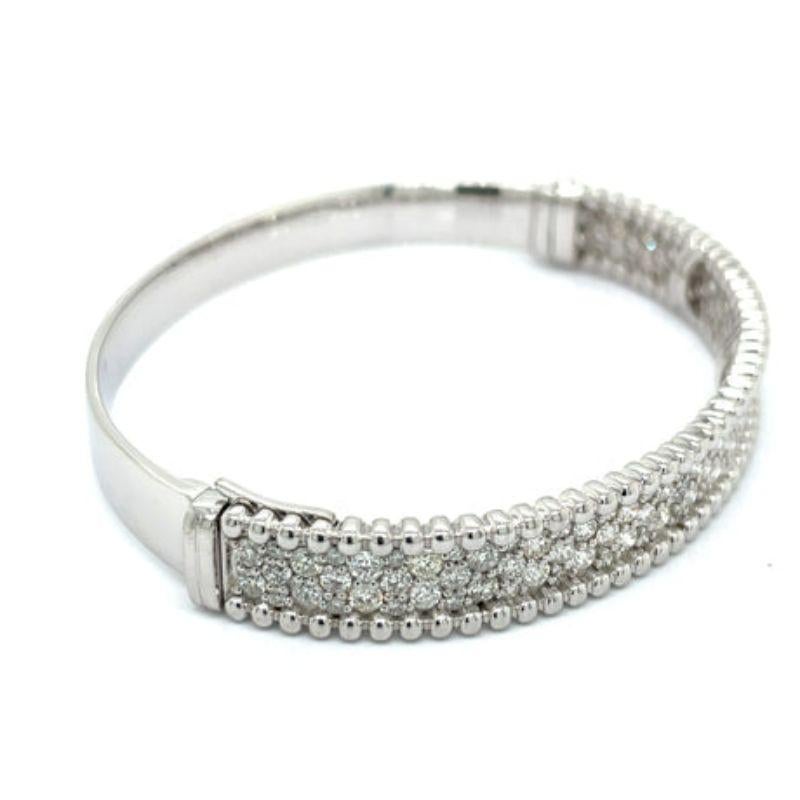 Designer 3.30 Carat Diamond Bangle

This delicate and luxurious Designer 3.30 Carat Diamond Bangle is a timeless and elegant accessory crafted from 18k White Gold. With a weight of 28.4 grams, this captivating design will add just the right amount