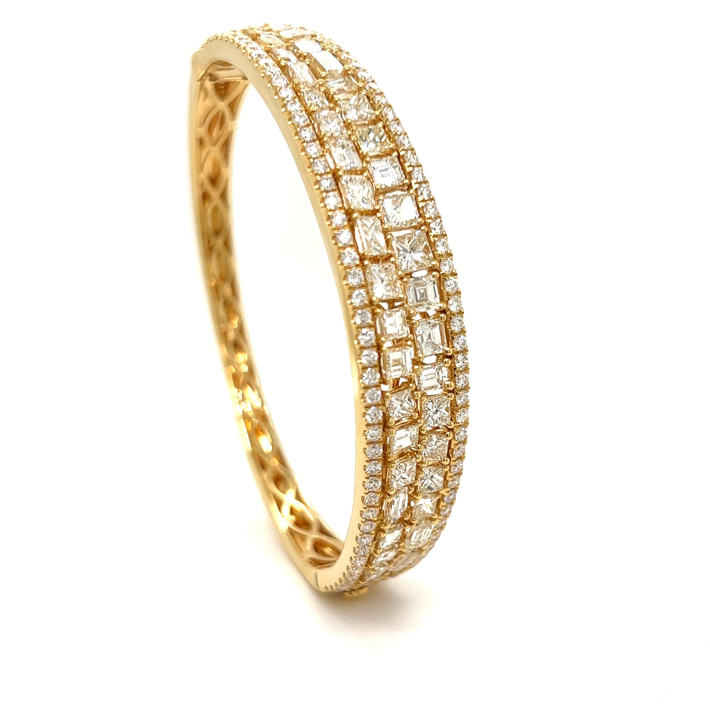 Exquisite designer diamond bangle.  Asscher, round, baguette and princess cut diamonds are expertly crafted into this marvelous bangle.  A total of 9.05 cttw in VS-SI clarity and G-H color diamonds set in 18K yellow Gold.  167 diamonds make this