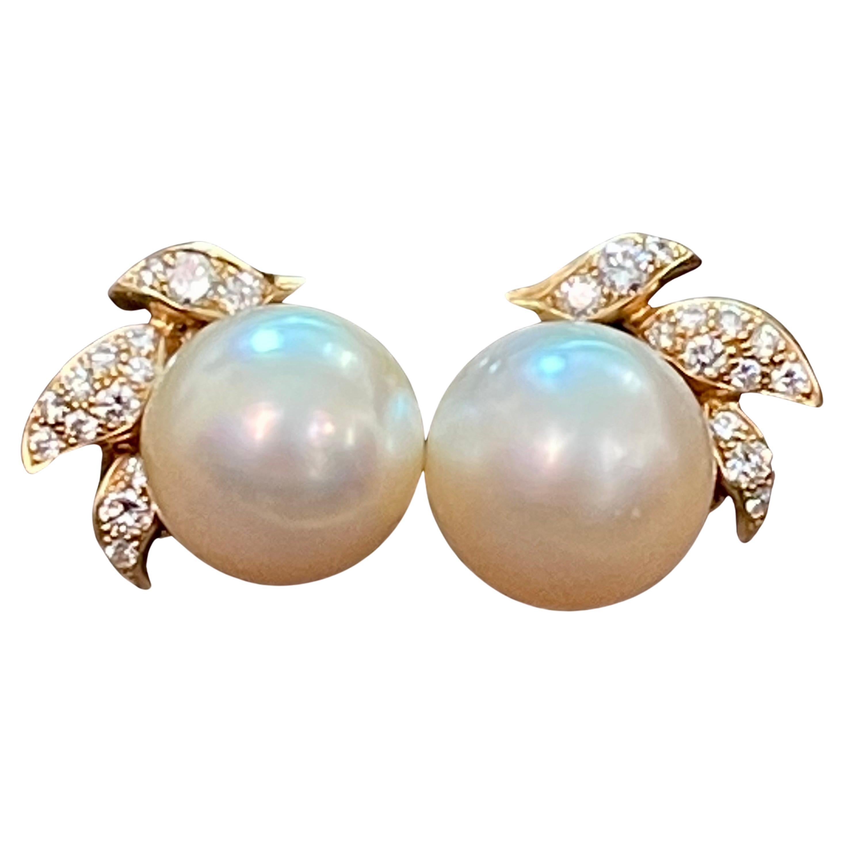 These are made and Signed  by designer Alexandria Reza 
14 MM  Round Designer A.Reza's Cream South Sea Pearl & Dimond Stud Earrings 18 K Yellow Gold Clip Earrings
 pearls are  clean but have some blemishes .
Light golden or Cream in color
Three