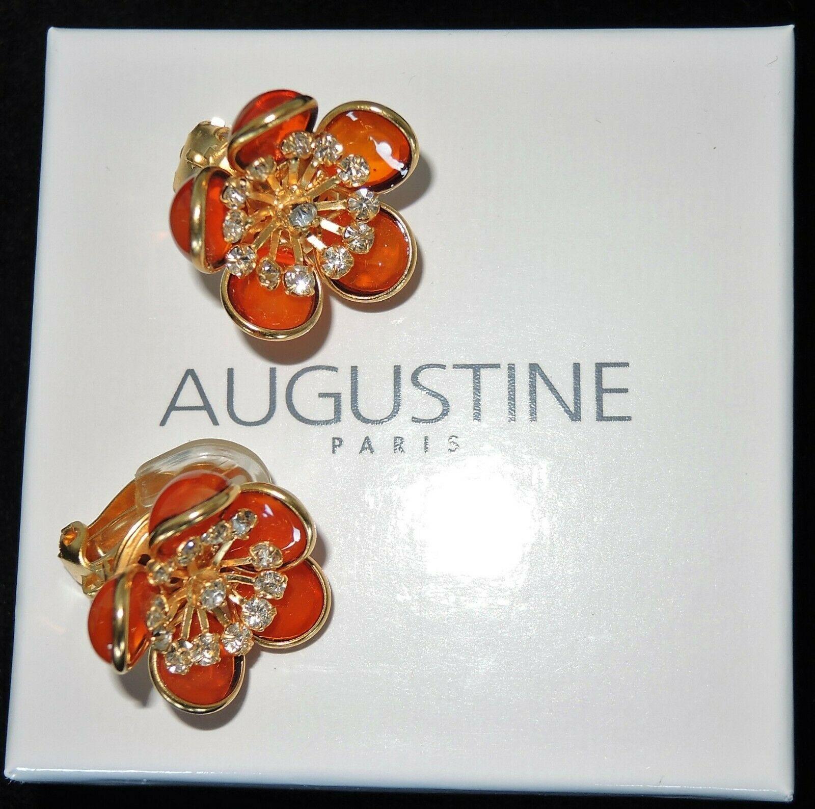 Simply Fabulous Clip on Flower Earrings designed by AUGUSTINE Paris and produced by Thierry Gripoix. Featuring Gripoix glass Flower petals in orange (milky, not translucent); center of each flower prong set with small clear Crystals. Gold-plated