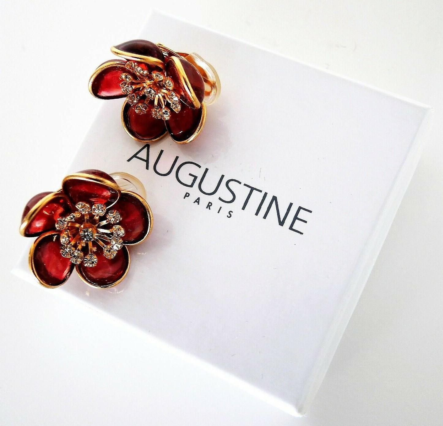 Simply Fabulous Clip on Flower Earrings designed by AUGUSTINE Paris and produced by Thierry Gripoix. Featuring Gripoix glass Flower petals in translucent Pink, center of each flower prong set with small clear Crystals. Gold-plated mounting. Approx.