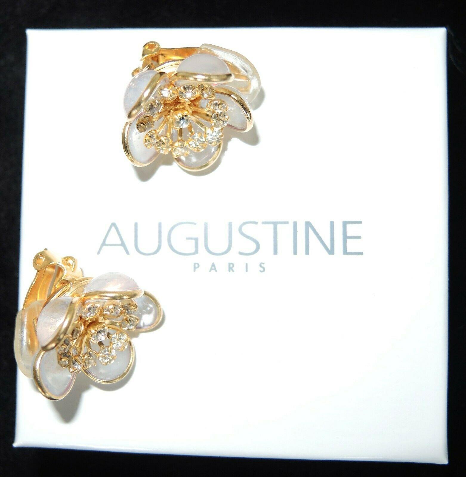 Simply Fabulous Clip on Flower Earrings designed by AUGUSTINE Paris and produced by Thierry Gripoix. Featuring Gripoix glass Flower petals in translucent light lilac, center of each flower prong set with small clear Crystals. Gold-plated mounting.