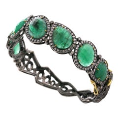Bracciale firmato con smeraldo verde e pavé di diamanti in oro e argento 18 ct.