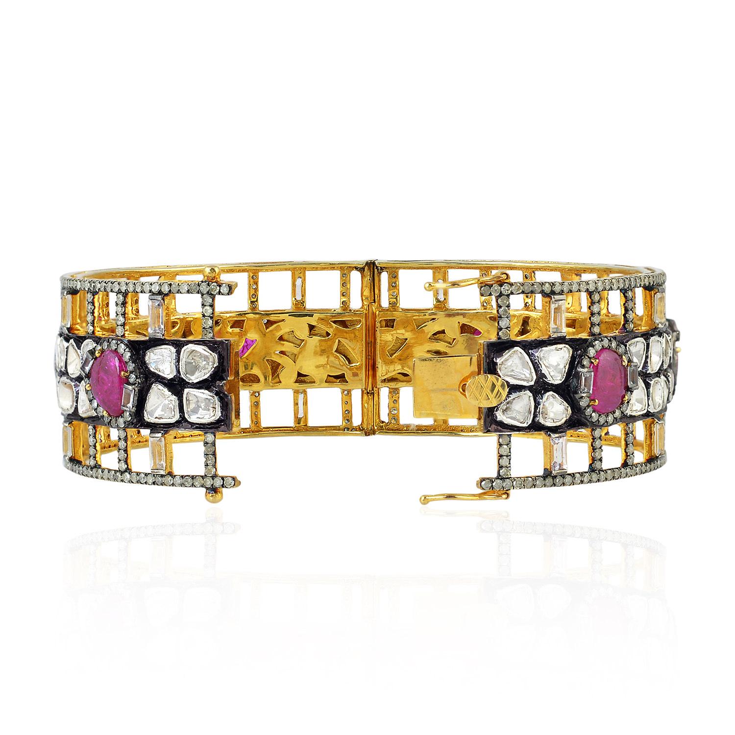 Modern Designer Bangle with Ruby and Sapphire Set Surrounded by Pave Diamonds For Sale