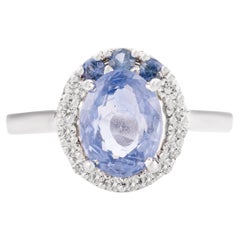 Anillo de compromiso de zafiro azul y diamante de diseño en oro blanco macizo de 14k