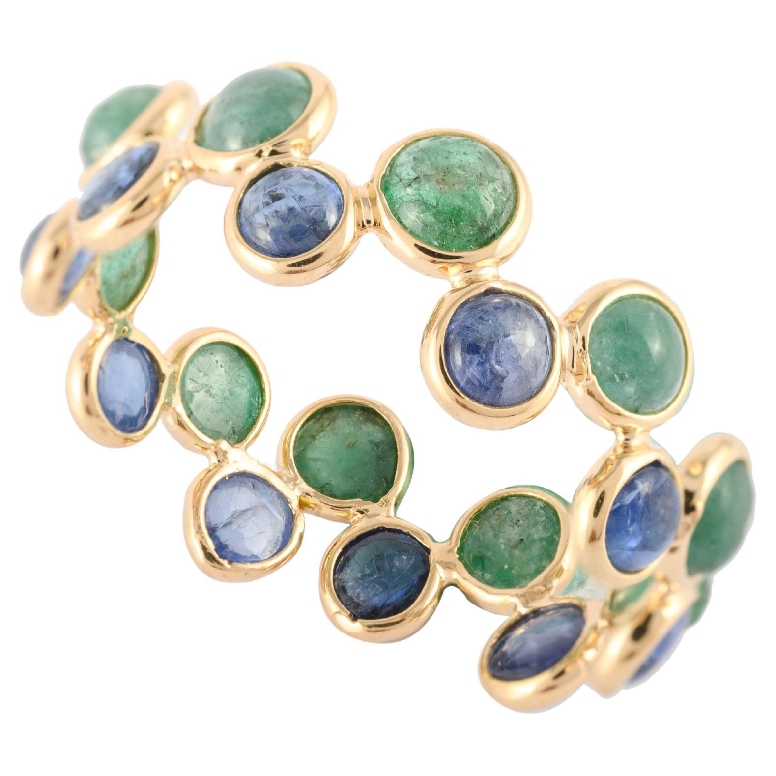 Designer-Eternity-Ring aus 18 Karat Gelbgold mit blauem Saphir und Smaragd