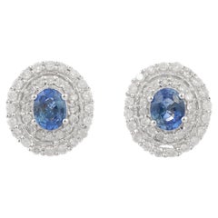 Designer Blue Sapphire Stud Earrings with Halo of Diamonds in 14K White Gold