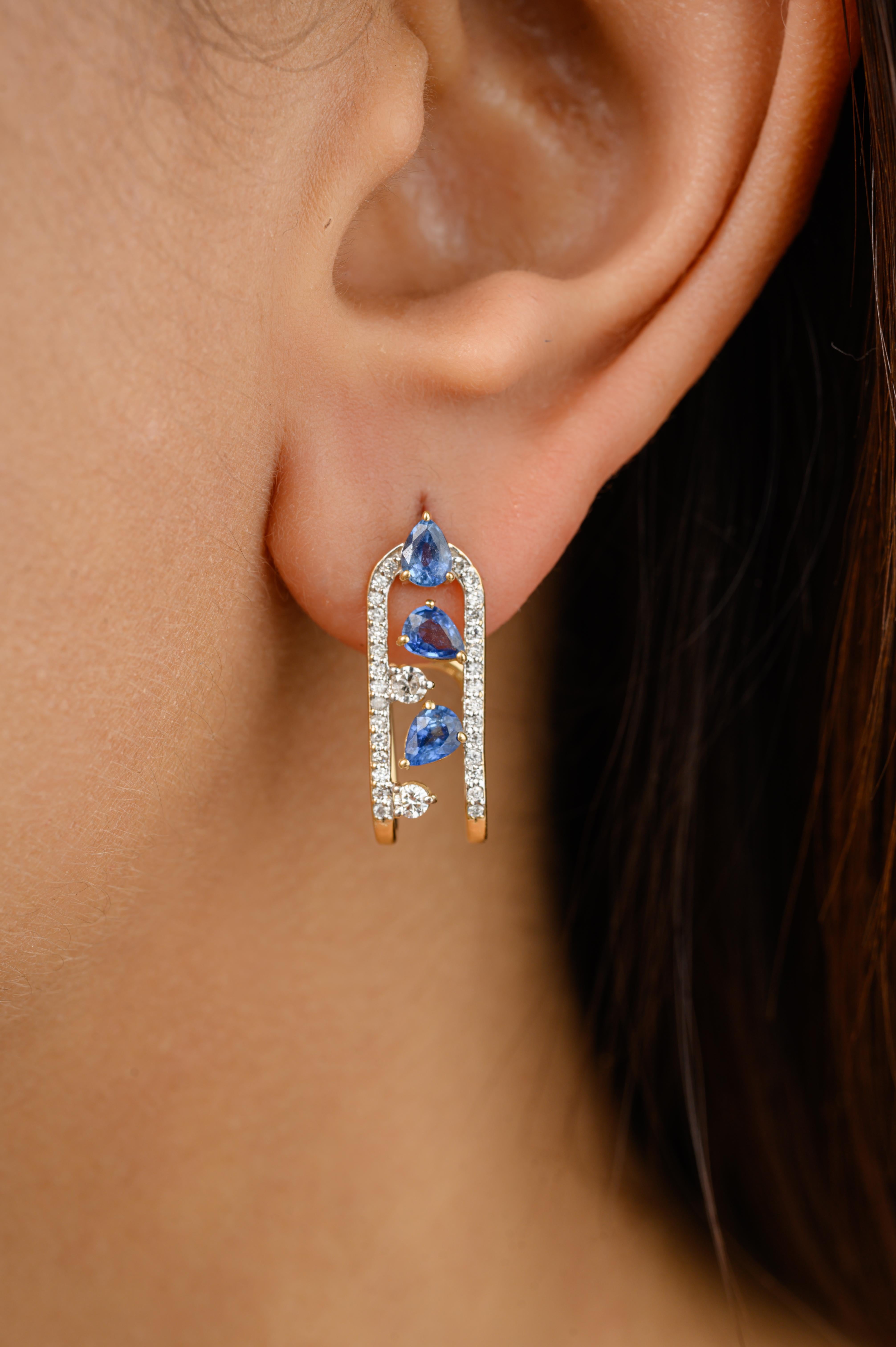 Designer Blue Sapphire U Shape Wedding Earrings with Diamonds in 18K Gold to make a statement with your look. You shall need these studs earrings to make a statement with your look. These earrings create a sparkling, luxurious look featuring pear