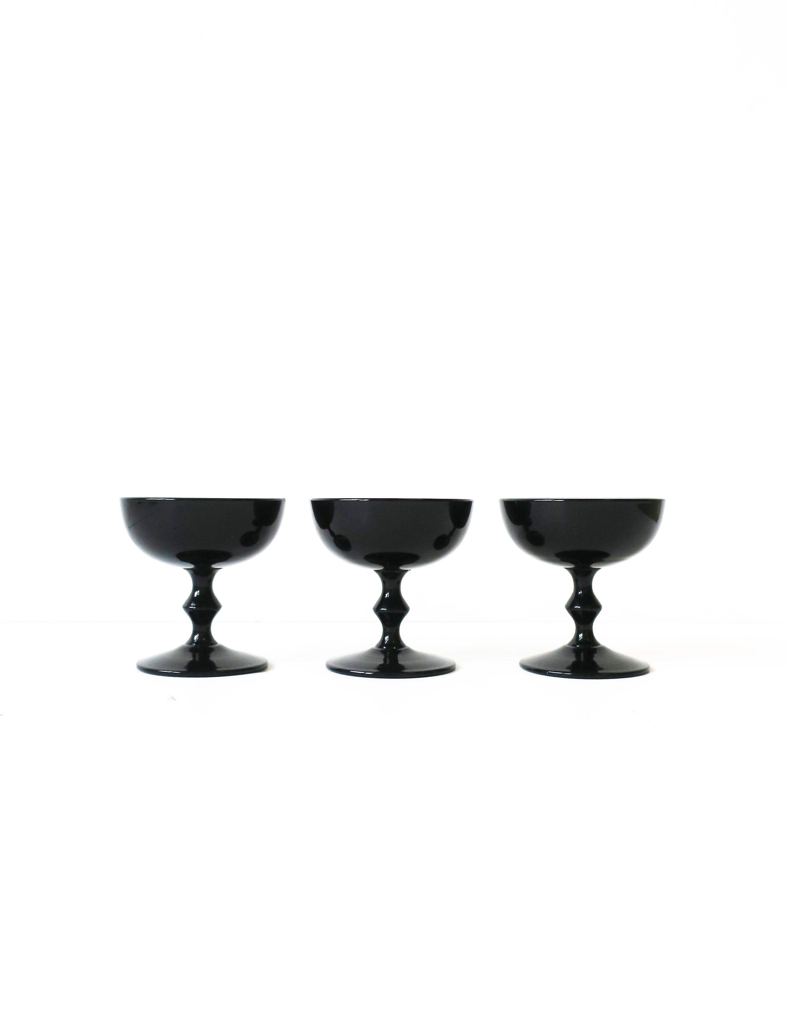 A chic set of three (3) vintage authentic designer Carlo Moretti black and white Italian Murano Champagne coupe or cocktail glasses, circa mid-20th century, Italy. A rare set retaining original label on bottom as show in images #15 and 16. Set