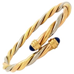 Designer Cartier 18 Karat Gold Lapis Lazuli Twisted Bypass Cuff Bangle Bracelet