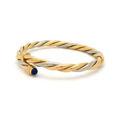 Designer Cartier 18 Karat Gold Lapis Lazuli Twisted Bypass Cuff Bangle Bracelet