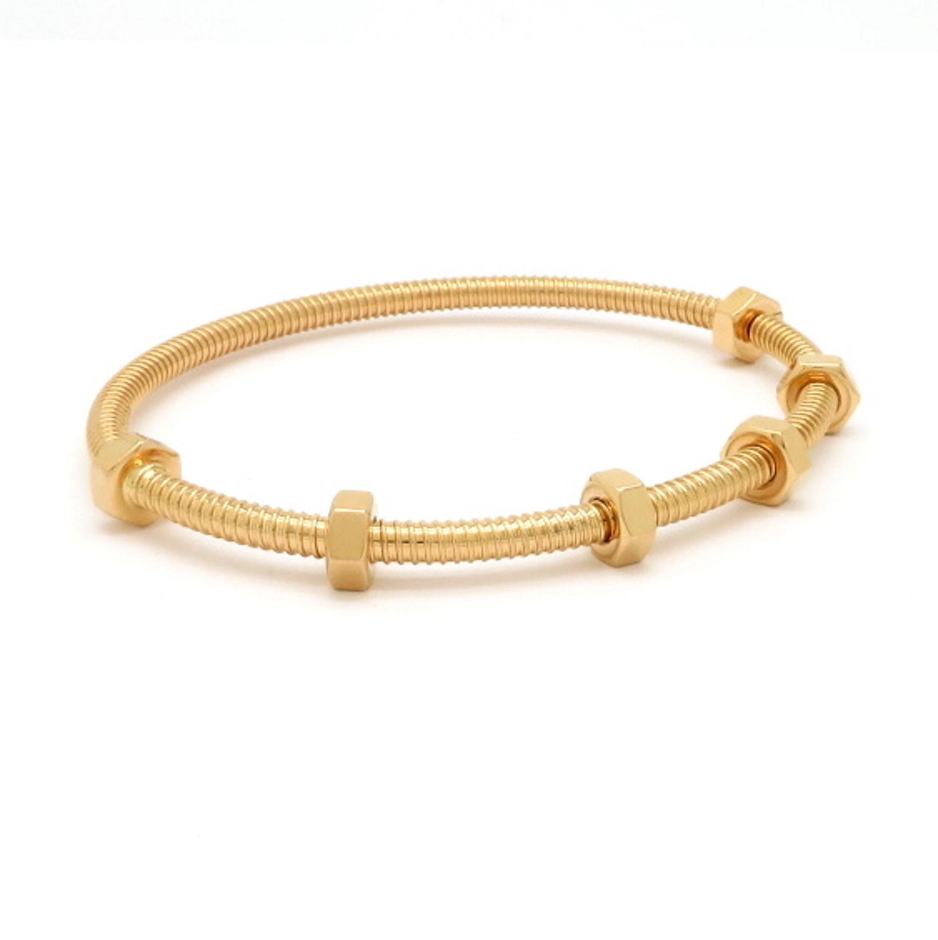 Designer Cartier 18K yellow gold Ecrou de Gold bangle bracelet. The inner diameter measures 50 x 63 mm. It includes the original box and papers. Size 18. Serial #Fif772. The total net weight is approximately 29.50 g. Authenticity 100% Guaranteed. 