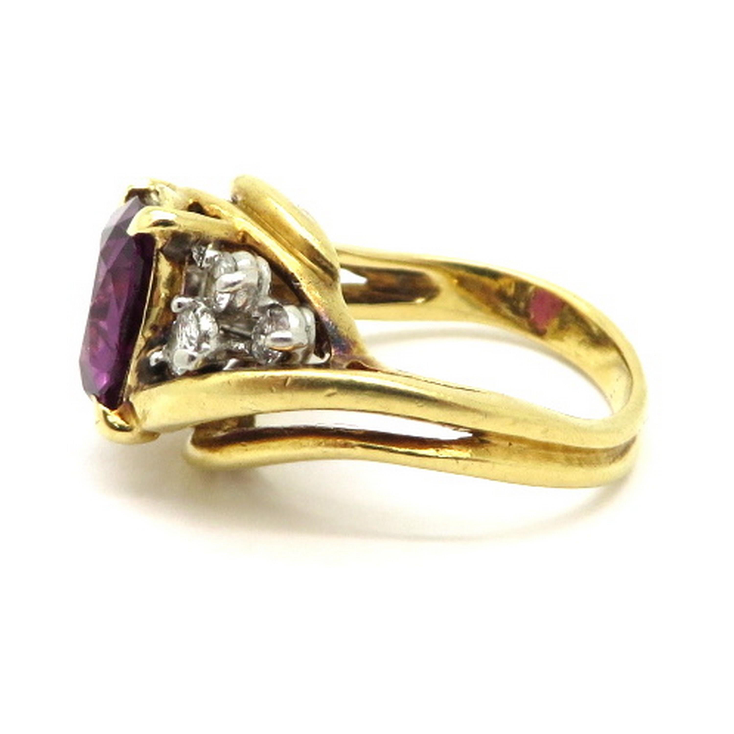 Estate designer Cartier GIA certified purple sapphire and diamond 18K yellow gold ring. Showcasing one cushion cut 2.30 carat purple sapphire. The ring includes the GIA colored stone grading report and the Cartier box. Number 3949, number 8100.
