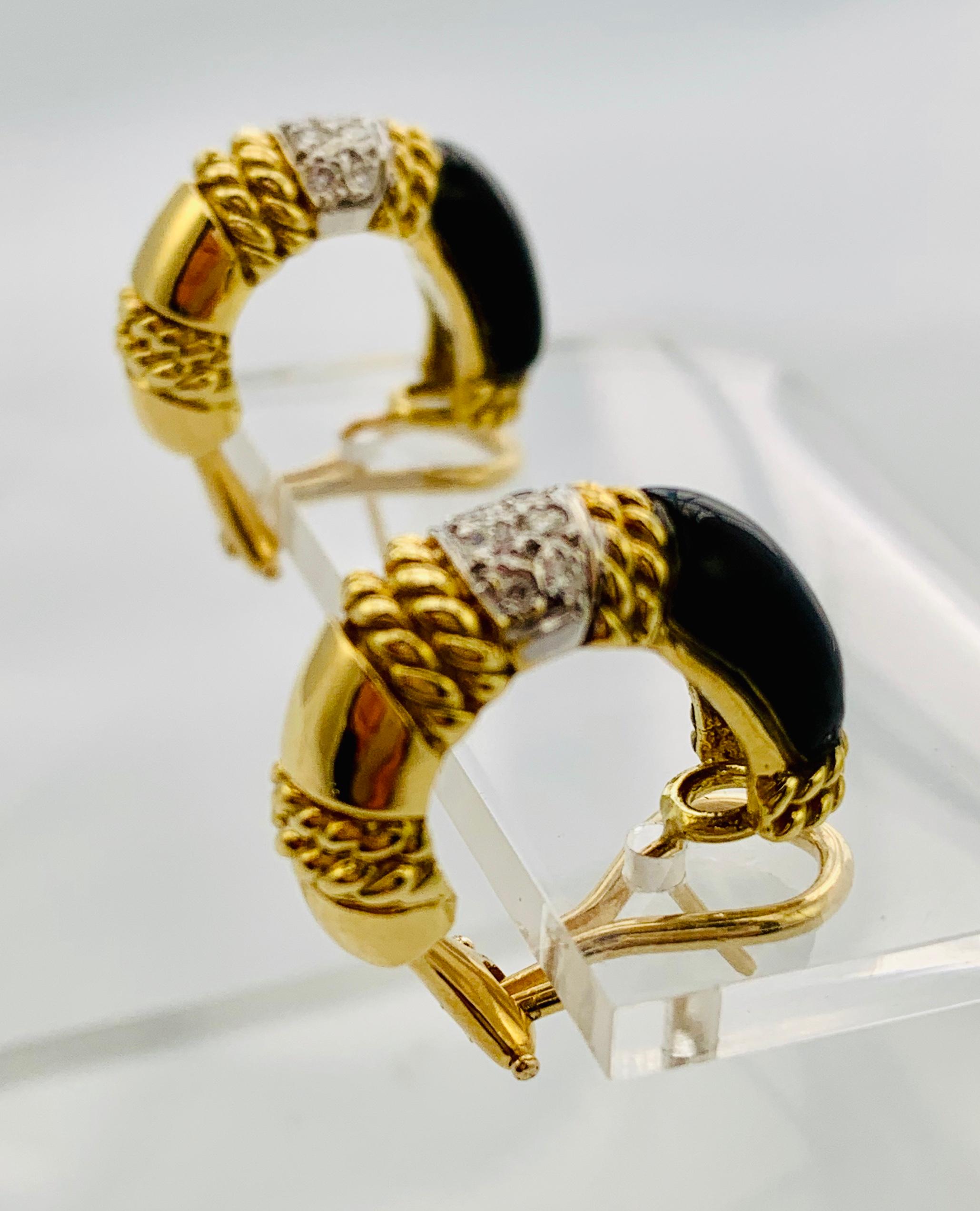 Gorgeous Designer Cassis Omega Backed earrings! These are in 18K yellow Gold and have three sections. One section is inlaid Black Onyx, one is diamond and one solid gold. There are 22 round, brilliant  diamonds that weigh approximately 1 carat, G-H