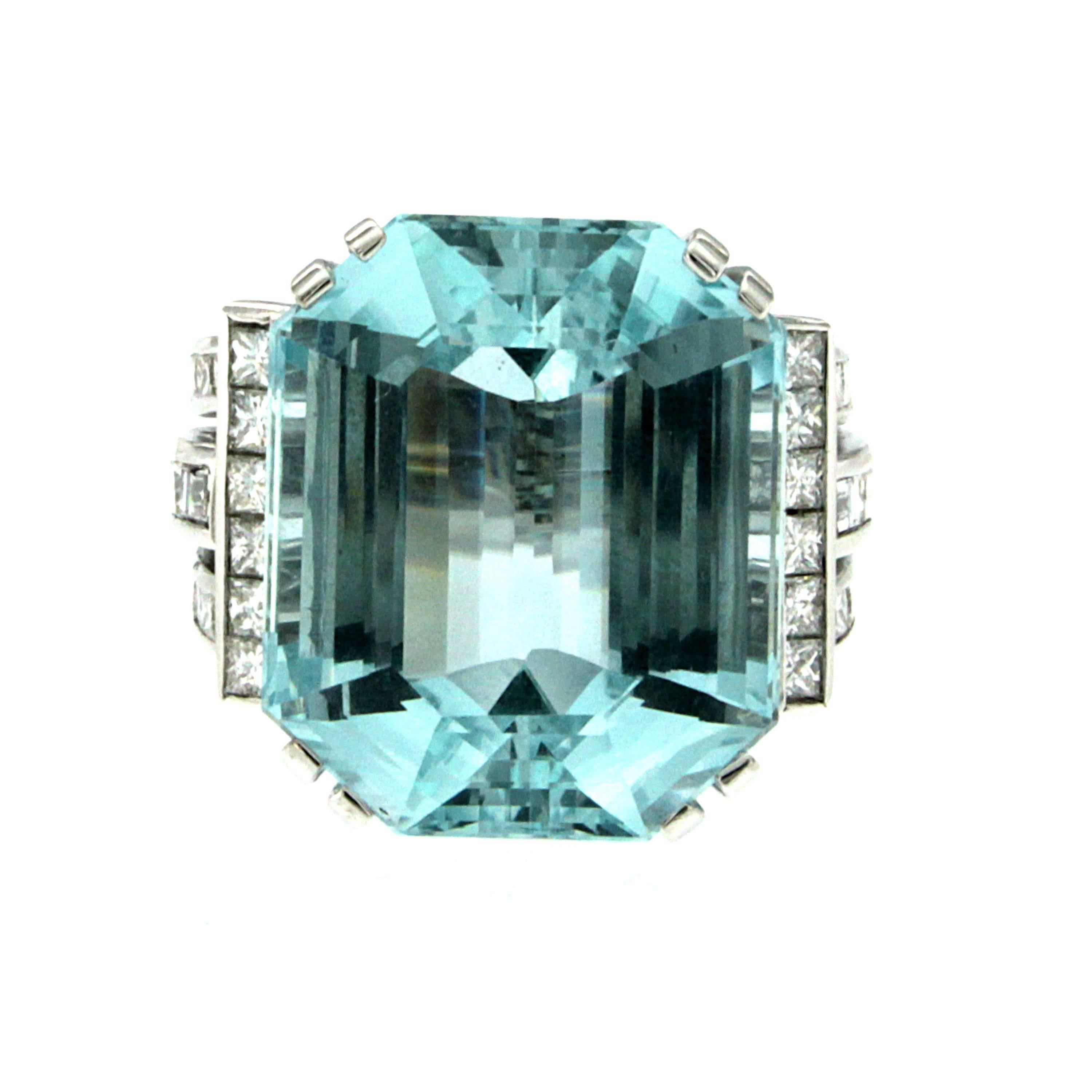 Stunning Aquamarine hand crafted Ring mounted in 18k white gold and set with a natural Certified Brazilian Aquamarine of Beautiful blue color, weighing 42 carats, measurements 23,74 x 19,70 x 13,10 mm and surrounded by 2,79 carats of Princess and