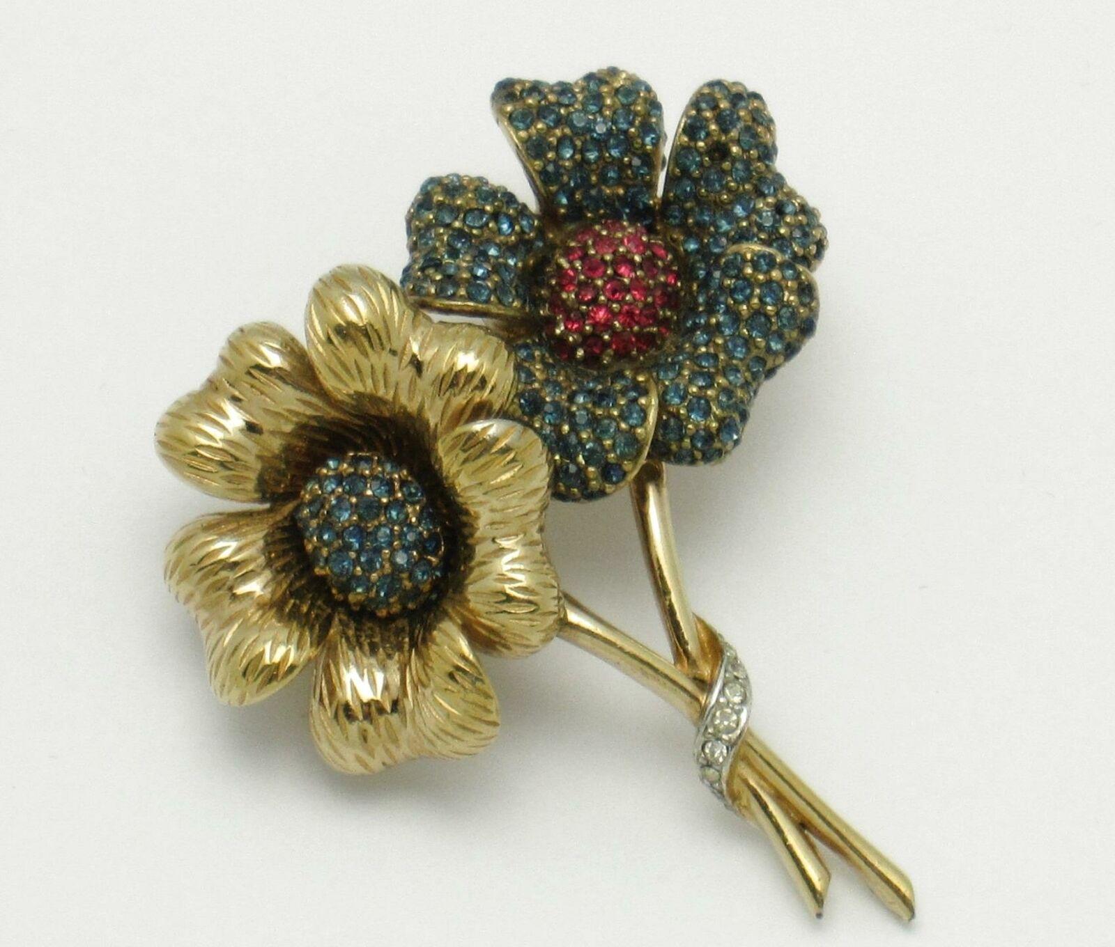 Beautiful Designer CINER Large Vintage Crystal and Gold plated Double Flower Brooch. One flower displays ornate gold plated petals with a mound of blue Sapphire Crystals at the center. The petals on the other flower are encrusted with Sapphire blue