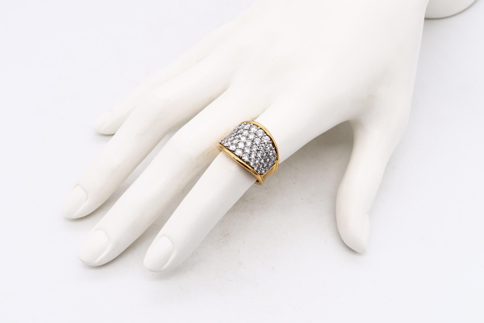 Designer ring with Exceptional Diamonds.

A modern one-of-a-kind sleek piece carefully crafted in solid yellow gold of 18 karats, with the surfaces finished with high polish. The upper part is made up with a .950/.999 platinum honeycomb element for