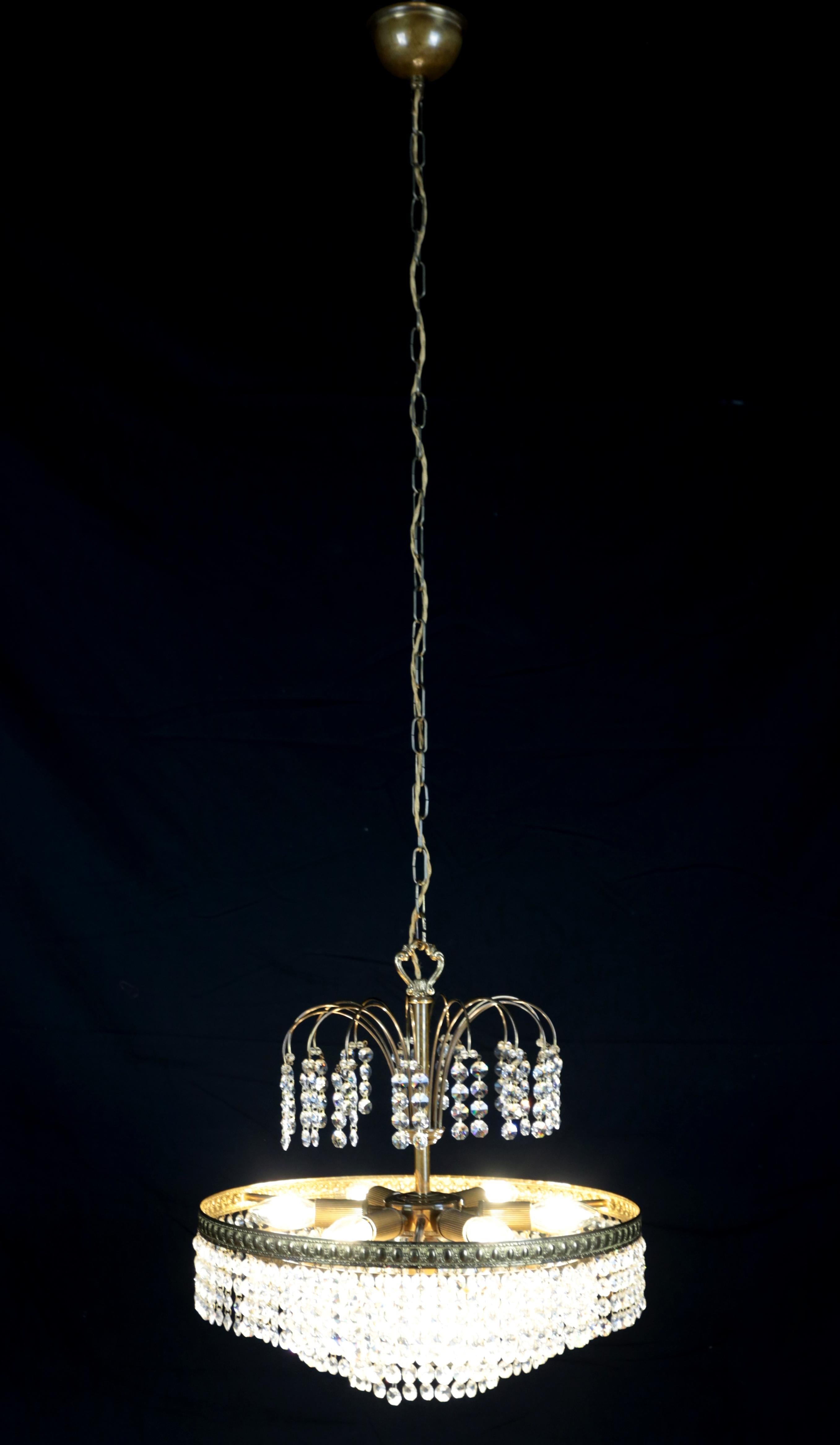 Hand-Carved Designer crystal chandelier with cascading pendants For Sale