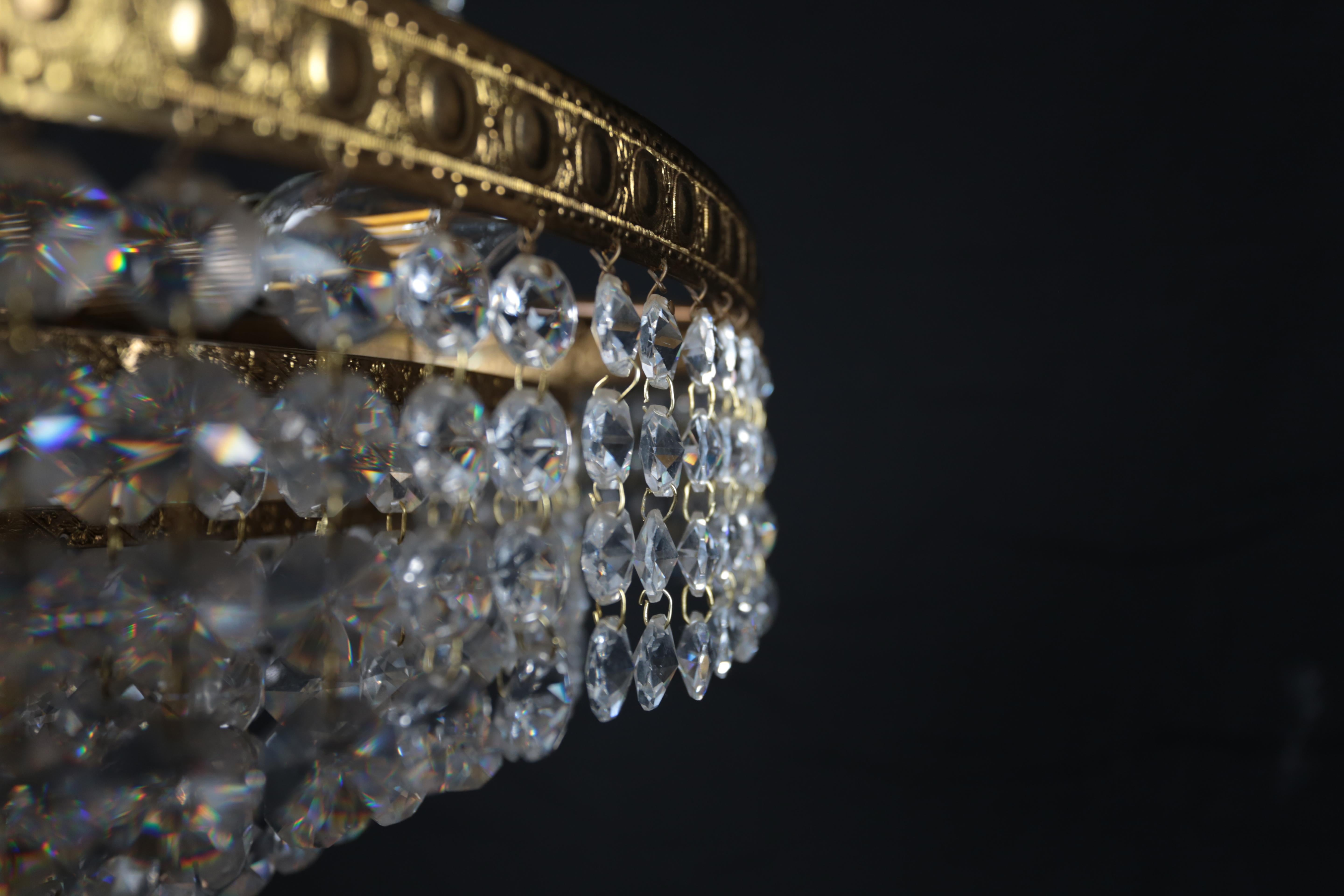 Brass Designer crystal chandelier with cascading pendants For Sale