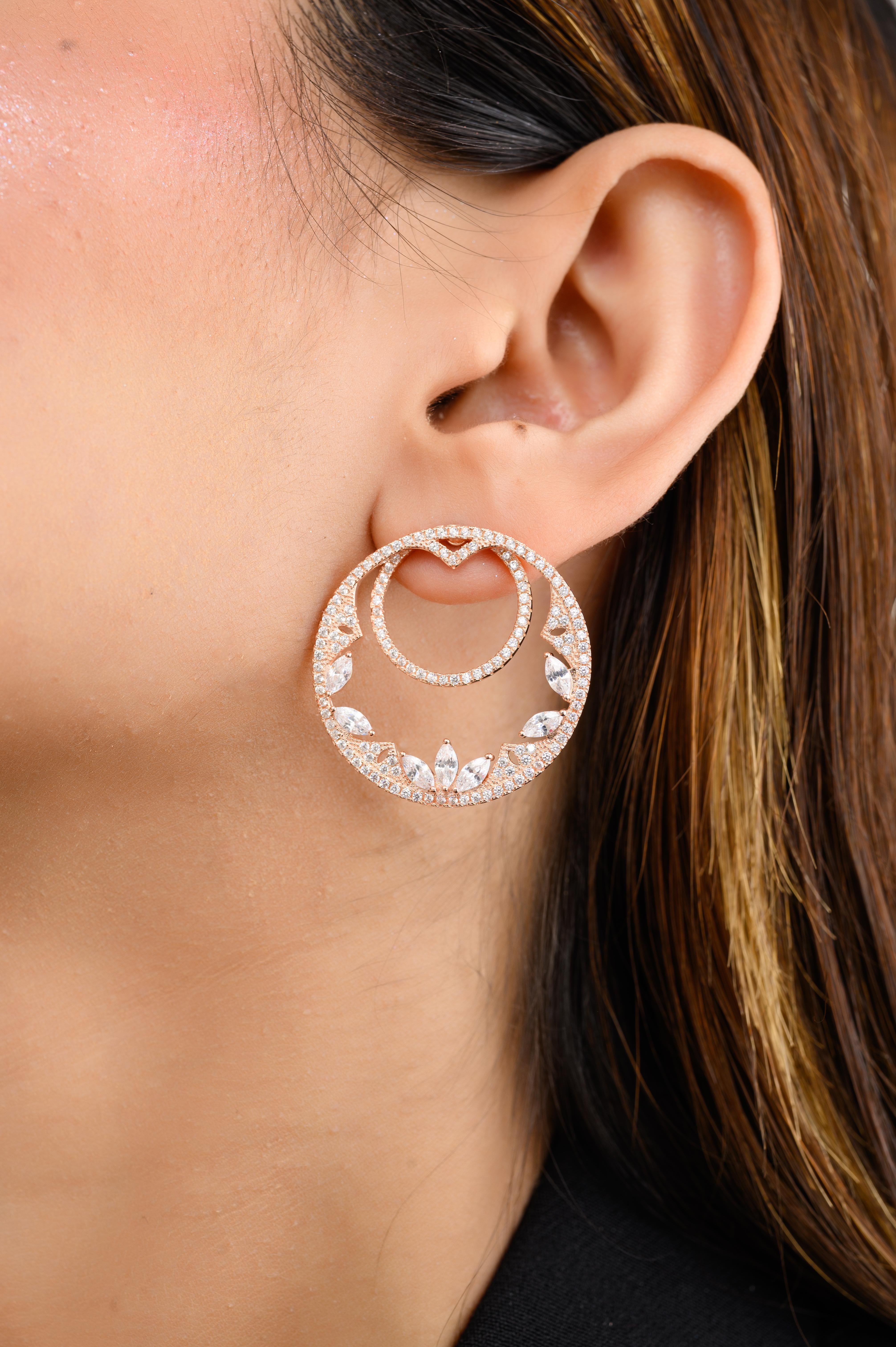 Designer Cubic Zirconia Statement Circle Stud Earrings in sterling silver. You shall need these stud earrings to make a statement with your look. Each piece features dazzling cubic zirconia stones, renowned for their brilliance and clarity, set in