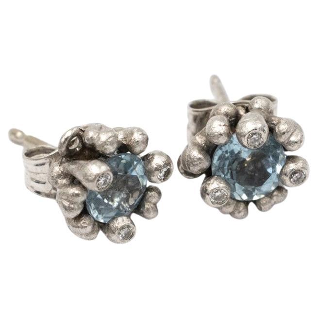 Designer earrings with aquamarines and diamonds, Ole Lynggaard, Denmark.