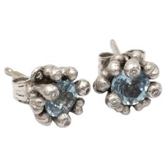 Designer earrings with aquamarines and diamonds, Ole Lynggaard, Denmark.