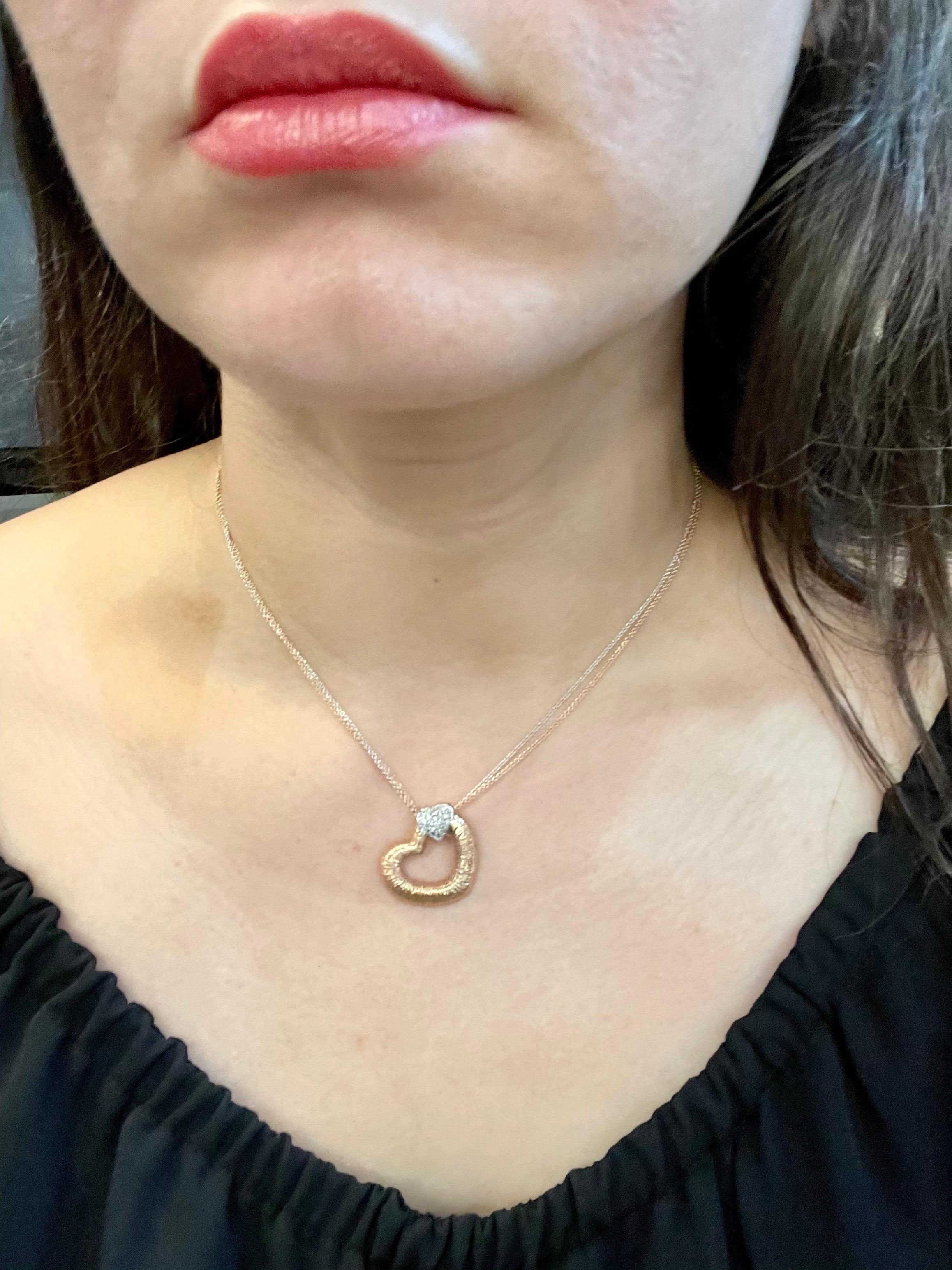 Designer Effy's 0.8 Ct Diamond Heart Necklace 14 Karat  Rose & White Gold Chain 
This spectacular  Necklace consisting of 0.18ct of natural brilliant round cut diamonds in a small heart bwhich is attached to larger heart made of rose gold.
comes