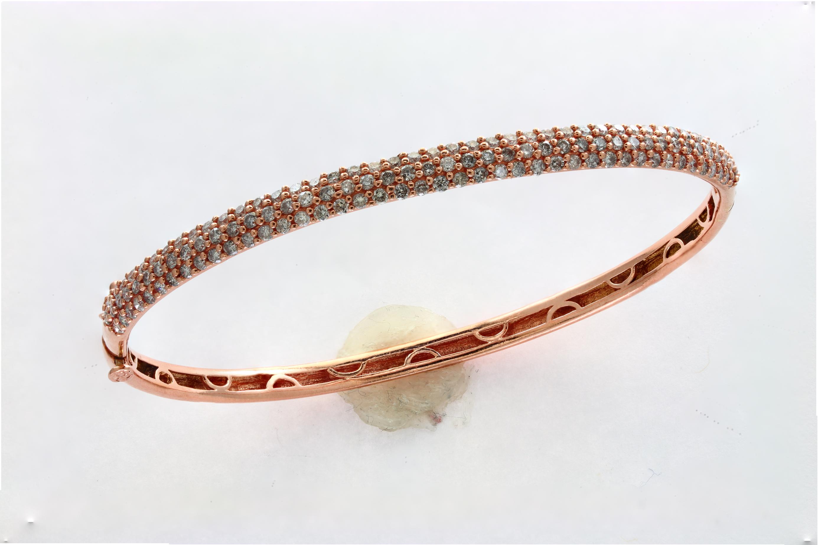 Designer piece for affordable price
Designer Effy's 1.5 Pointer Each, 1.8 Carat Diamond 14 Karat  Rose Gold Bangle
Set in three rows 1.5 pointer each diamond  , Total Diamond weight approximately 1.87  Ct Contemporary  14 Karat  Rose  Gold & Diamond