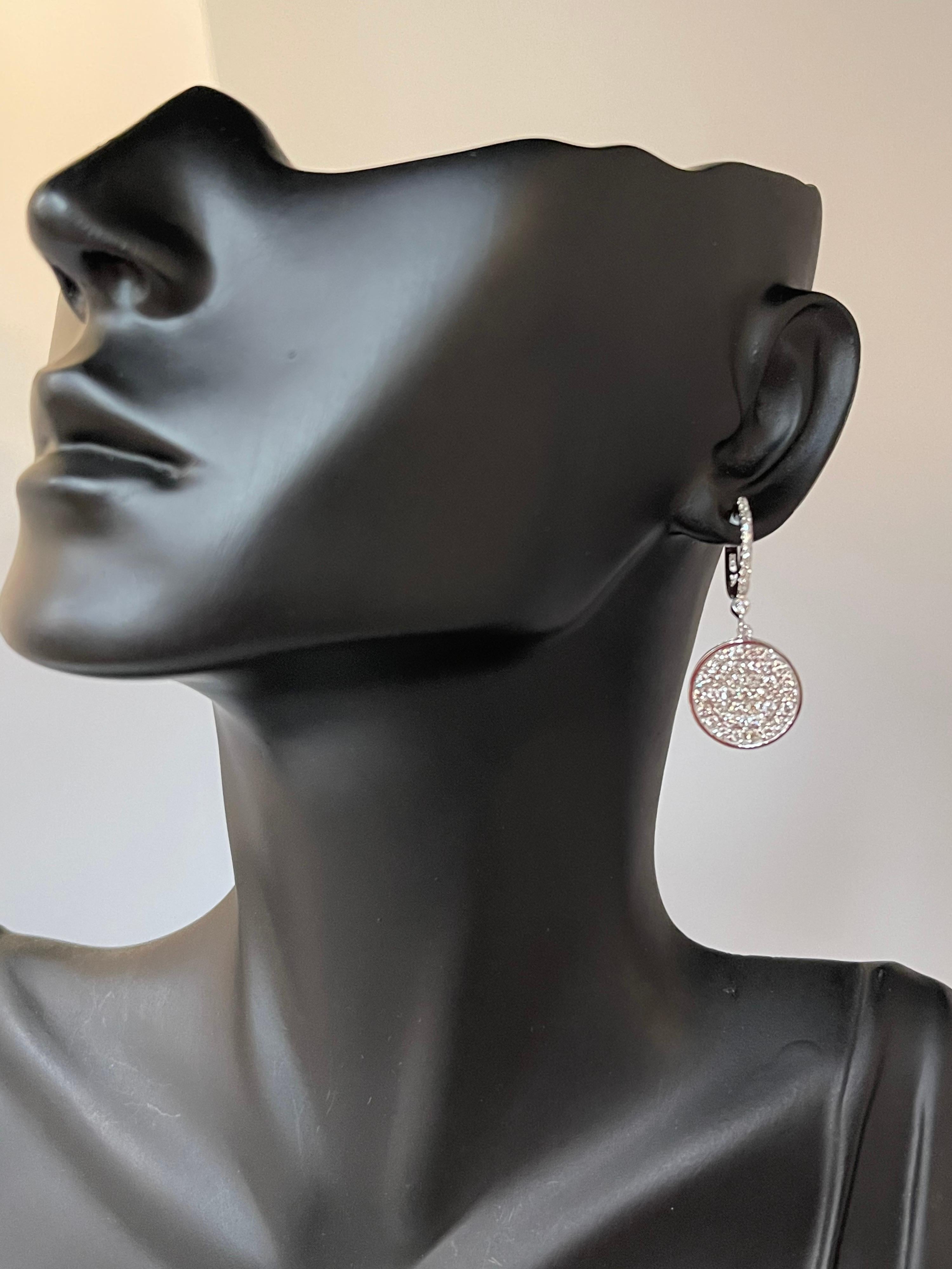 
Designer Effy's 1.58 Ct Natural Diamond Dangling Huggies Earrings 14K White Gold
Post Earrings with Small Huggies on the top . 
This exquisite pair of earrings are beautifully crafted with 14 karat White gold .
Weight of 14 K gold 6.8 grams
I did