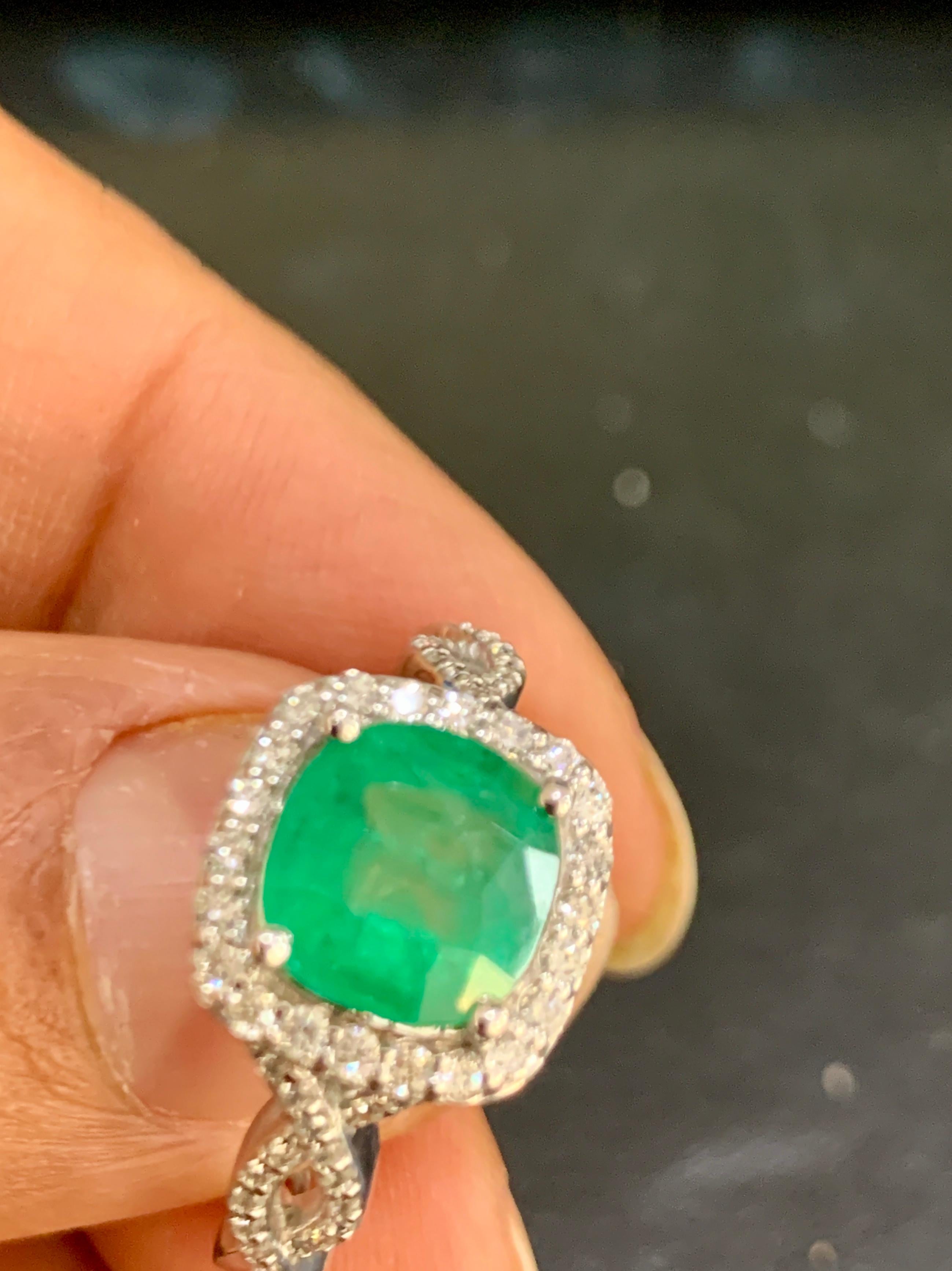 Designer Effy's 1.8 Carat Emerald And Diamond  Cocktail Ring 14 Karat White Gold
One 8 mm square emerald approximately 1.8 ct
Total  Approximately 0.35 ct  Brilliant cut round diamonds .
34 diamonds are 0.4 pointer and 22 are 1 pointer