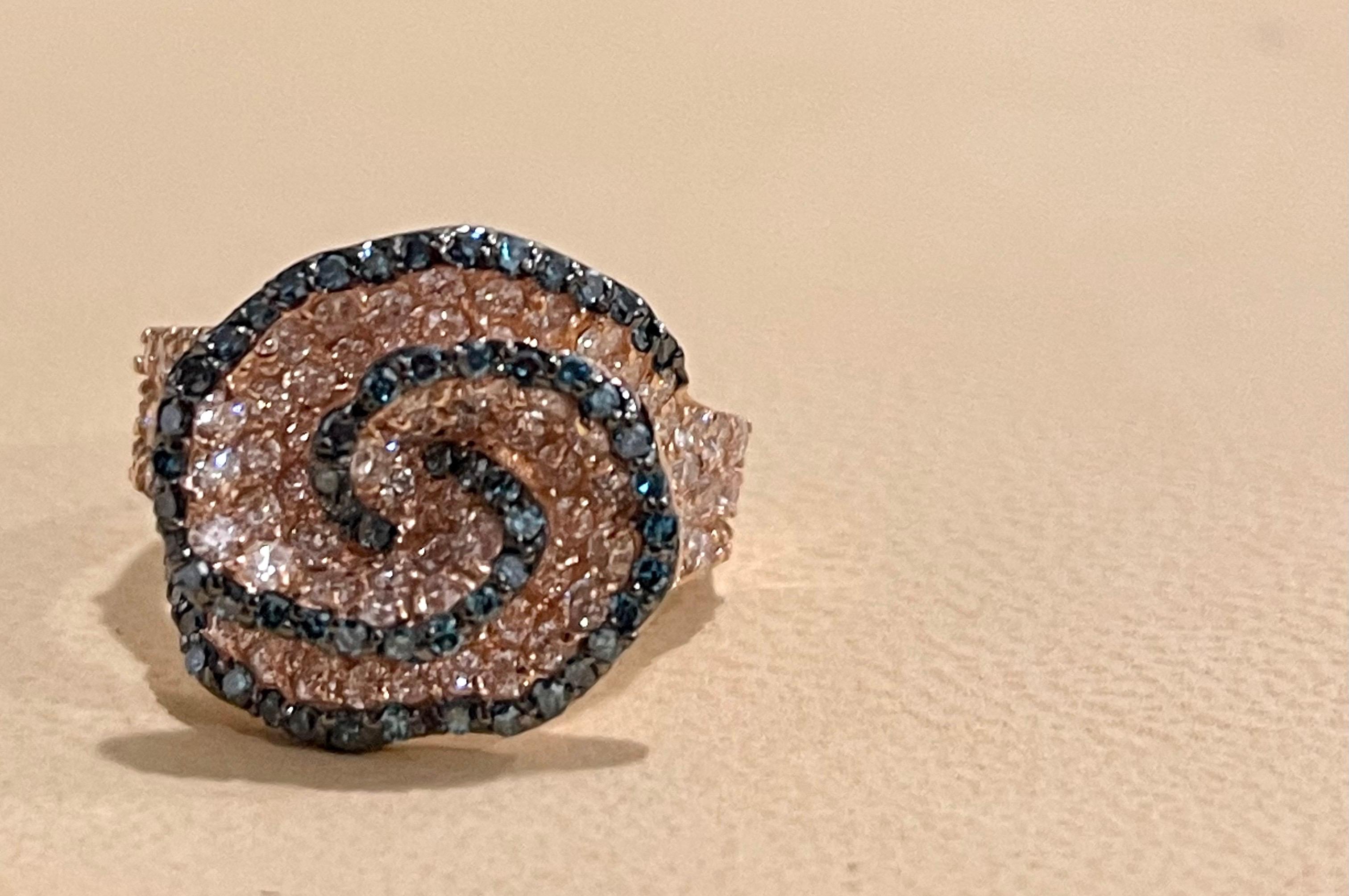Designer Effy's 2.21 Carat Blue & White Diamond 14 Karat Rose Gold Cocktail Ring
Blue and White diamond ring in Rose or pink Gold
Total  Approximately 2.21  Brilliant cut round diamonds 
Sparkle is unbelievable.
Diamond SI to VS  quality and G/H