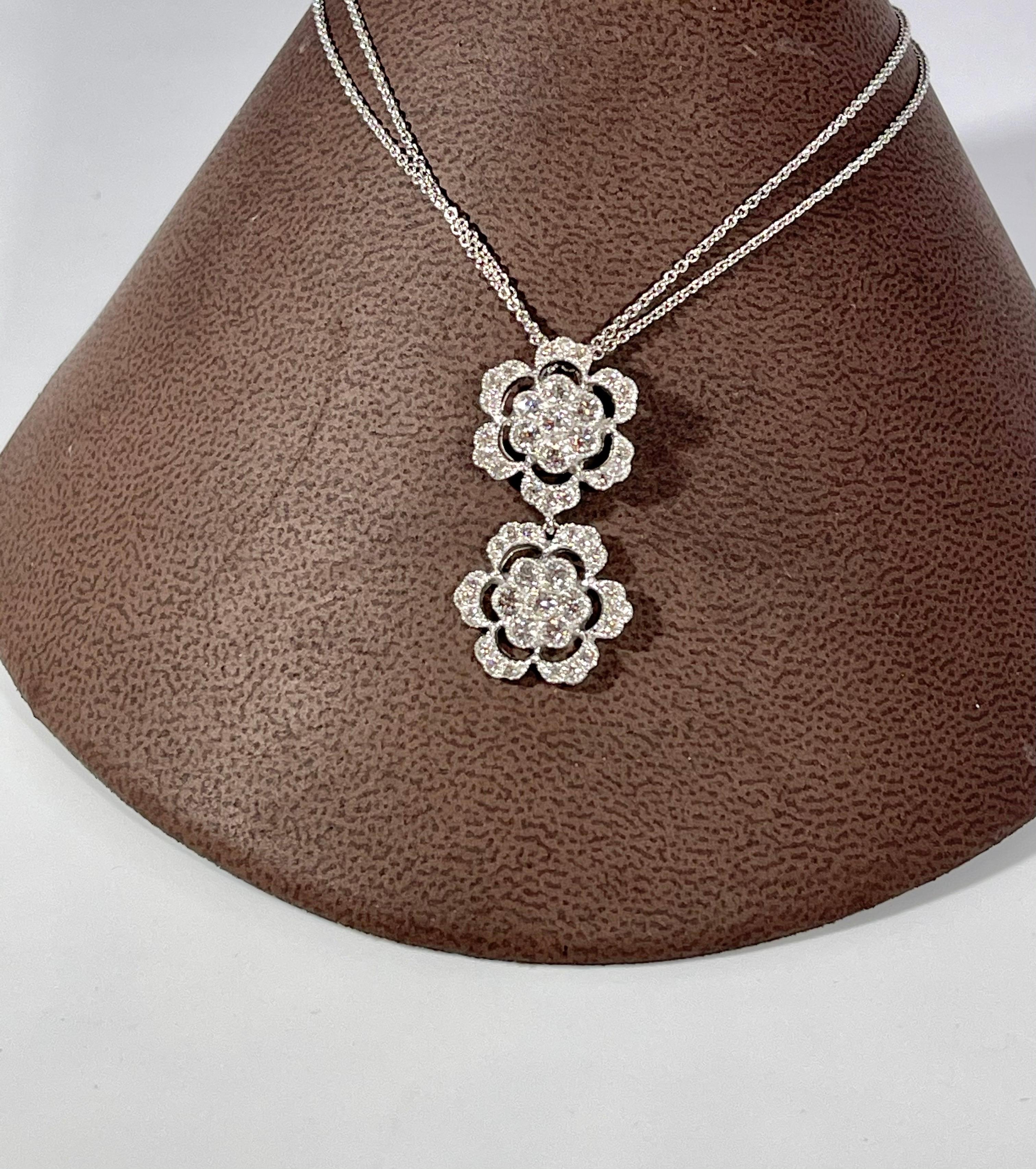 Designer Effy's Diamond Double Flower Double Chain Pendant/Necklace 14 KW Gold

This spectacular Pendant Necklace  consisting of two flowers made of  diamonds , all in  round shape .
Total Carat weight of the diamond is 0.98 ct
very clean Stone no