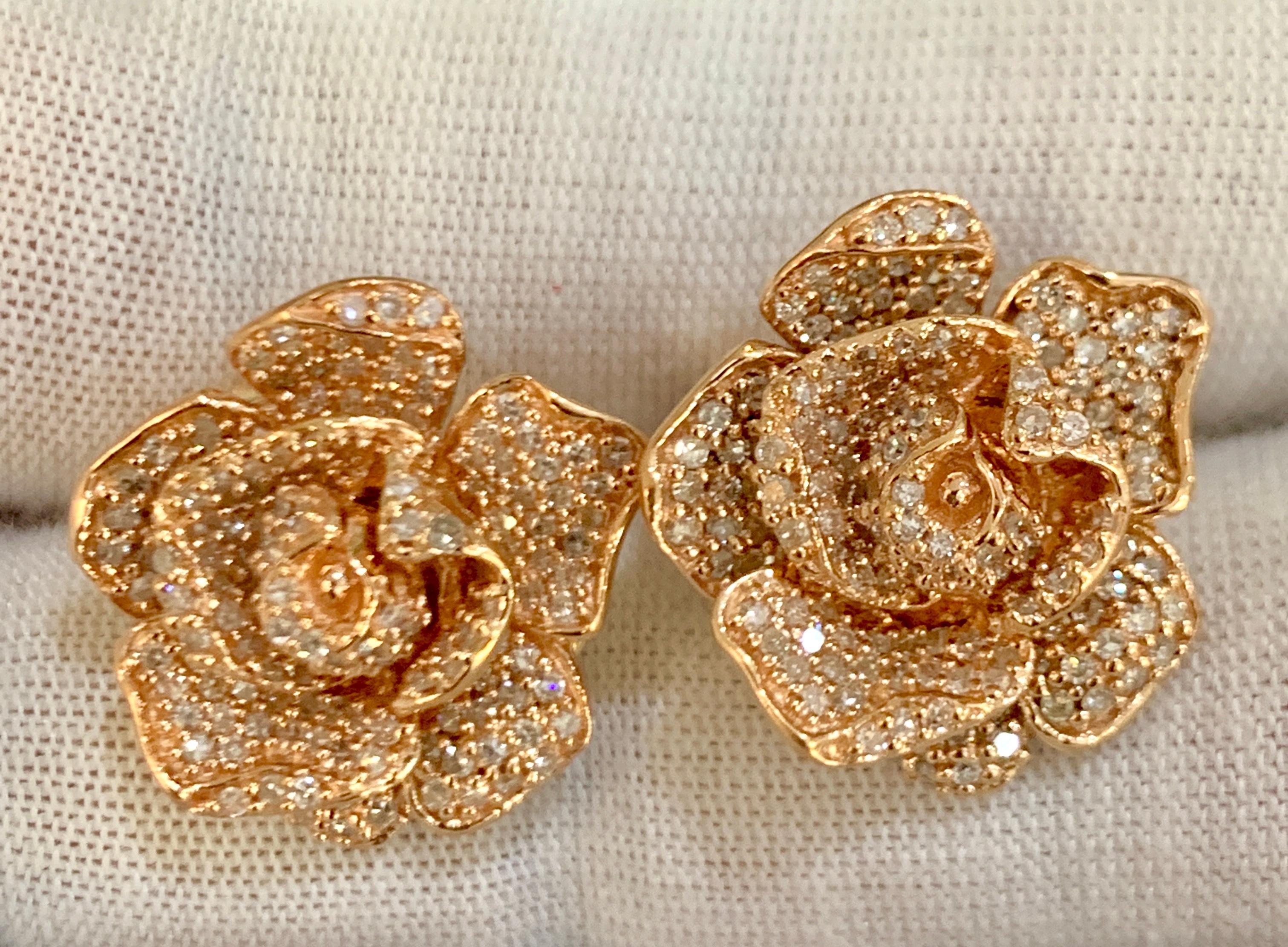 
Designer Effy's Diamond Rose Flower Stud Omega back Earrings 14 Karat Rose Gold
Post with Omega back earring
This exquisite pair of earrings are beautifully crafted with 14 karat Rose gold .
Weight of 14 K gold 9.8  grams
292  pieces are 0.4