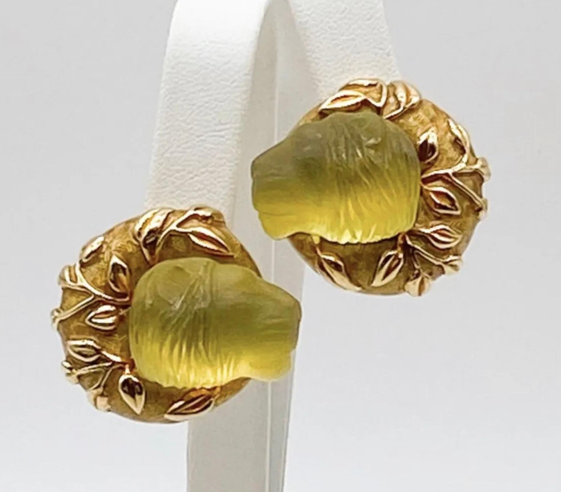 Authentic designer Elizabeth Gage Carved Beryl Lions Earrings  Mounted in 18k Gold with Original Box. 

Approx 1 5/8” x 1 5/8”. 46.5 Grams Total Weight. Clip On- Posts could be added by a jeweler.
