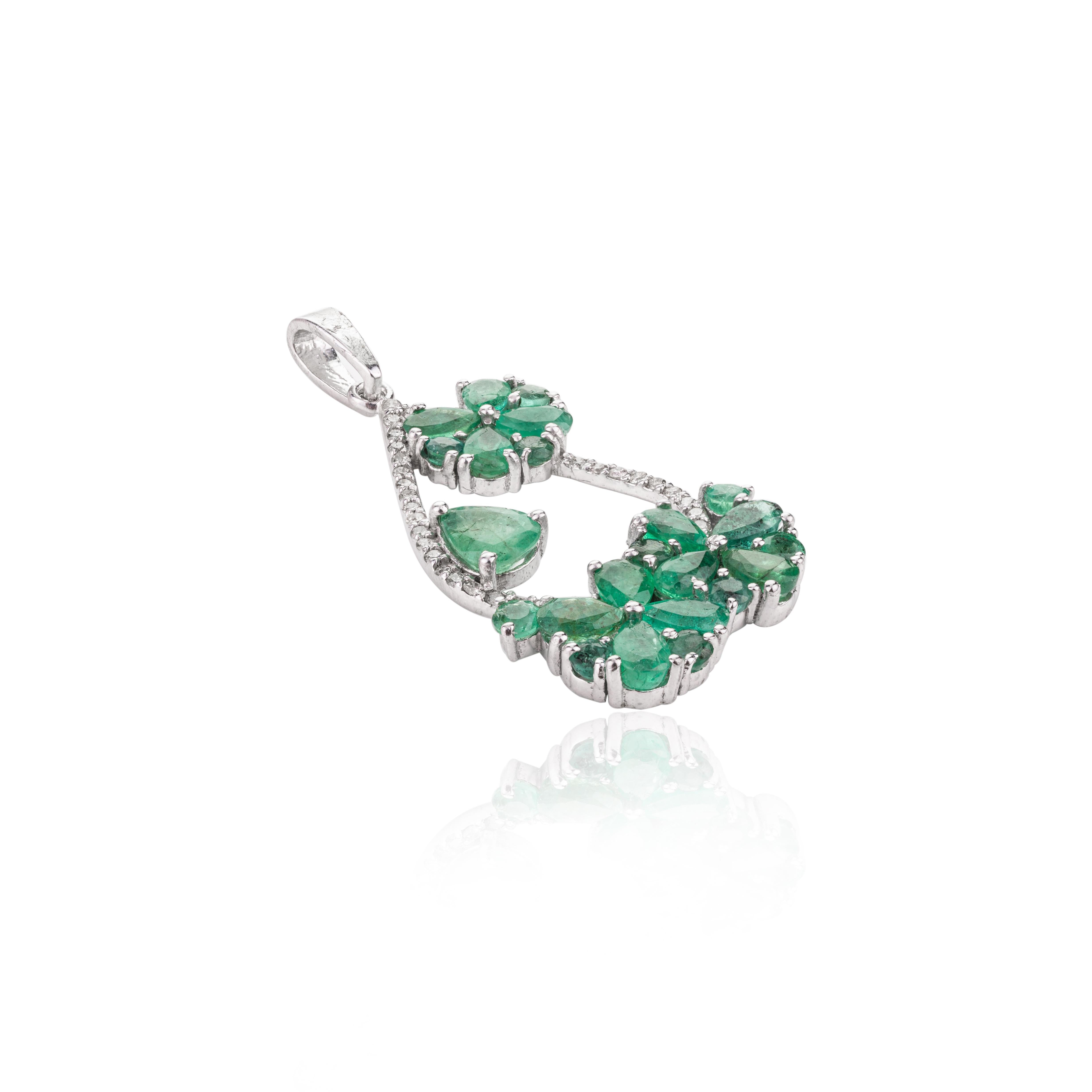 This Designer Emerald and Diamond Flower Wedding Pendant is meticulously crafted from the finest materials and adorned with stunning emerald which enhances communication skills and boosts mental clarity. 
This delicate to statement pendants, suits