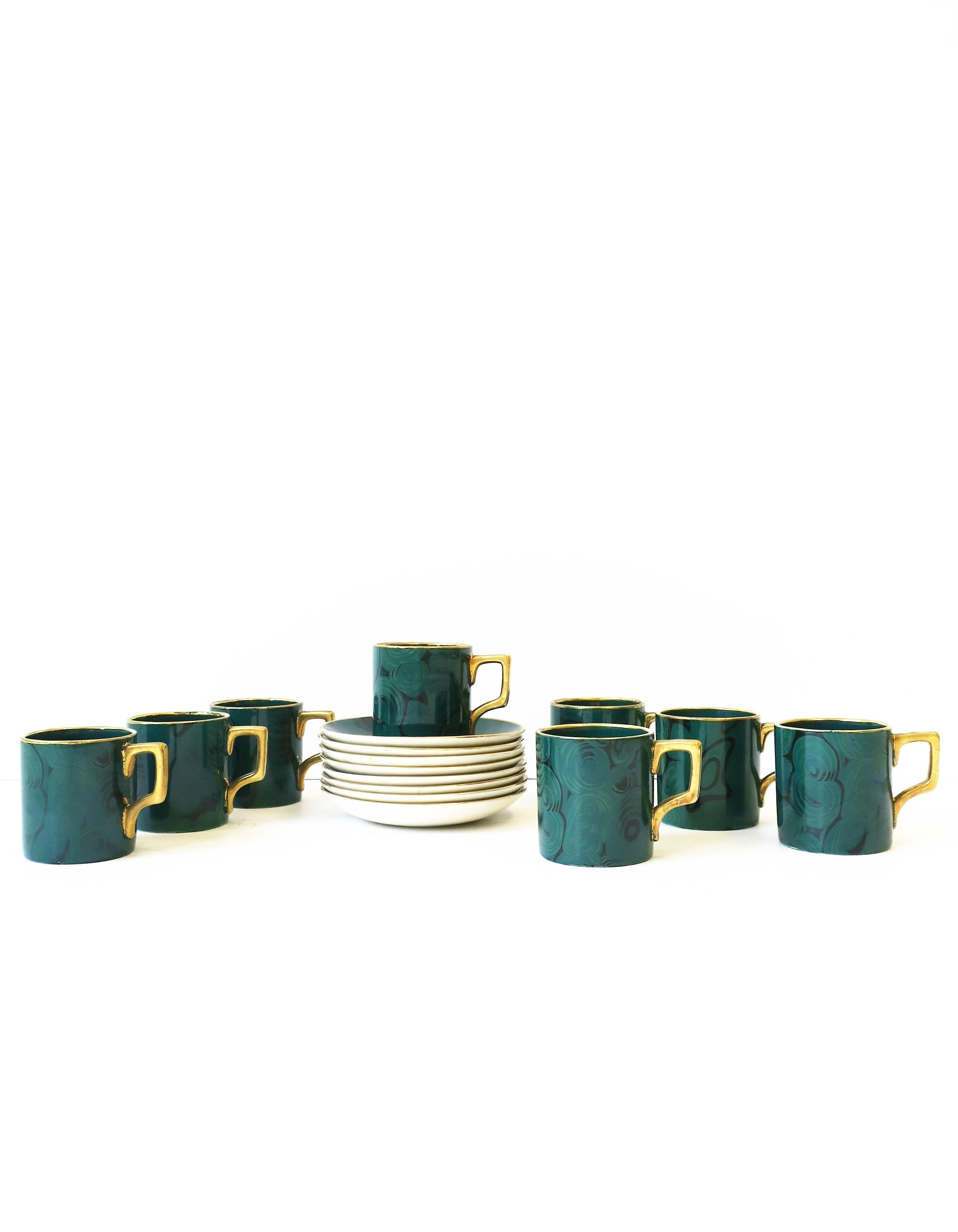 A beautiful and rare set of eight (8) English Portmeirion green Malachite and gold espresso coffee or demitasse tea cup and saucer, circa 20th century, 1960, England, by renowned British Designer, Susan Williams-Ellis. Both cup and saucer have a