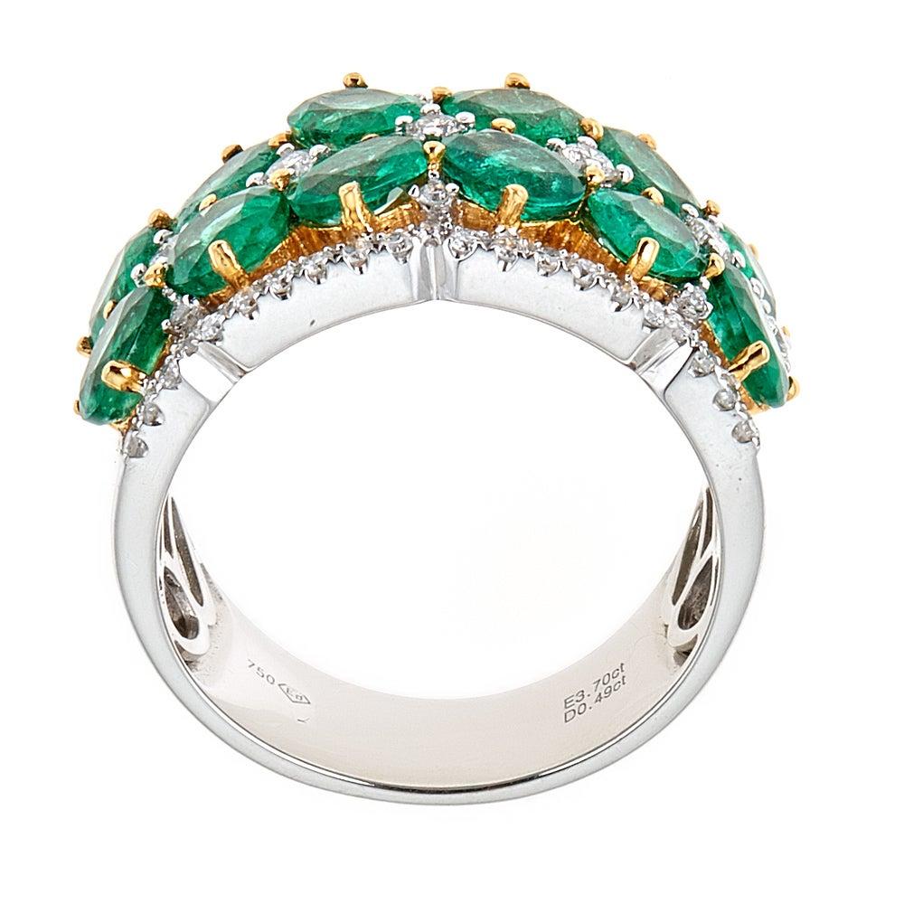 Designer Fine Jewelry Collection 3.7 Carat Emerald and Diamond 18 Karat Two-Tone Gold Ring Band

Royal elegance is presented in this band. Emerald is layered creating a flower ornament throughout the whole band, accented by 0.50 tcw shimmering