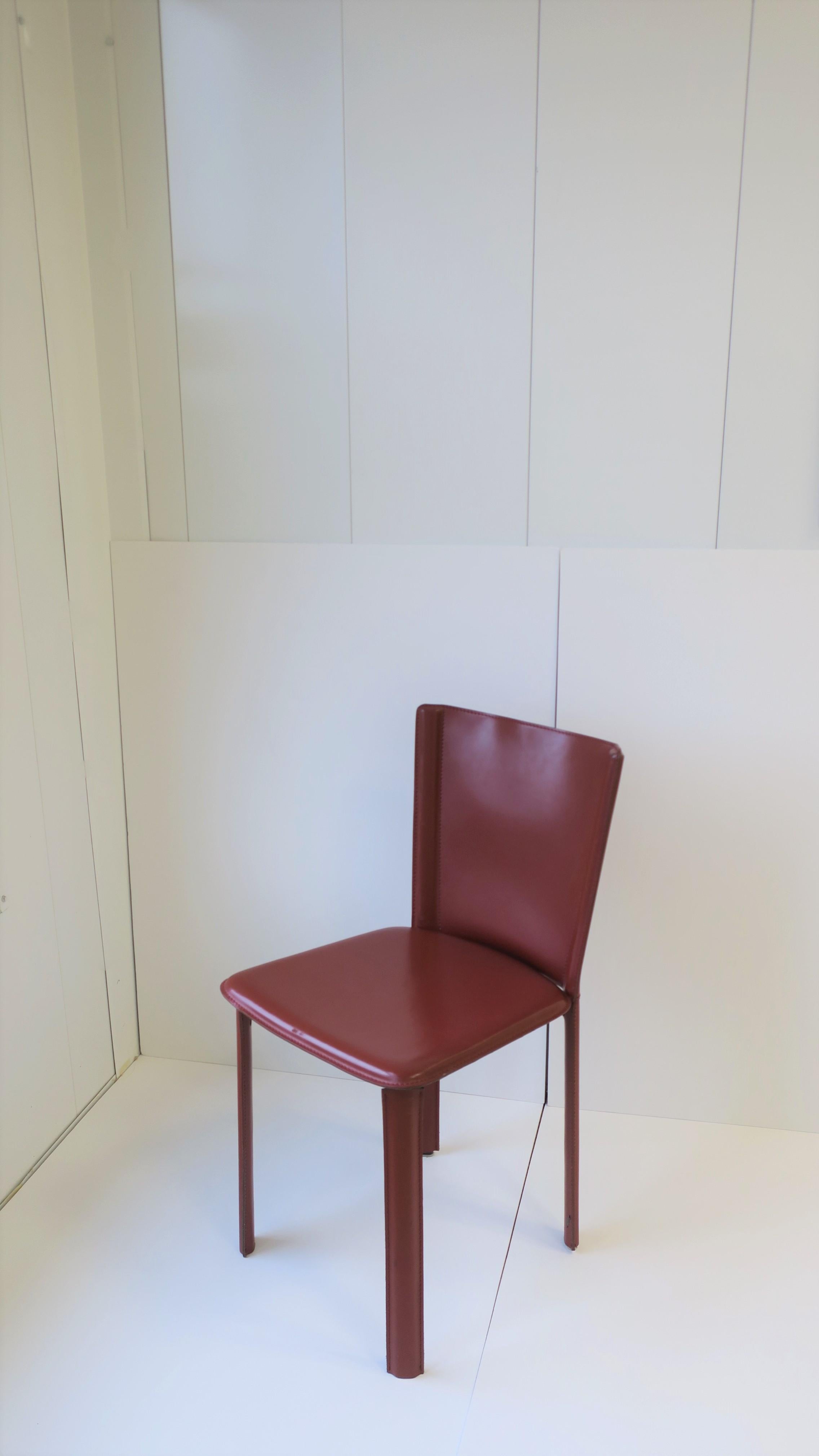 An Italian red burgundy leather desk or side chair by design company Frag. Made in Italy as marked. 100% leather. Similar in style to the Cassina leather 'Cab' chair. 

Measures: 16