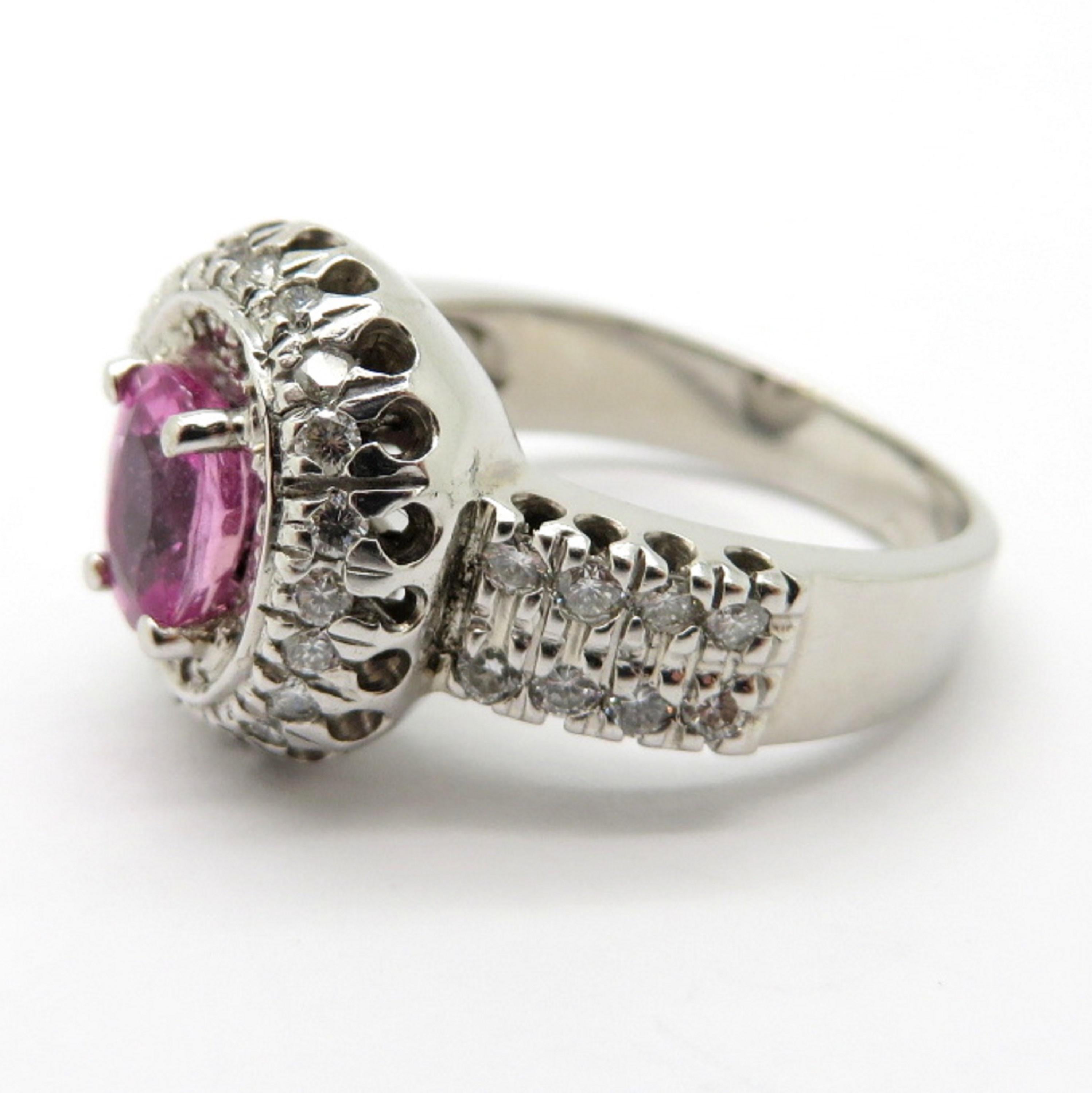 For sale is a beautiful estate 18K White Gold Pink Sapphire and Diamond Ring by designer Gregg Ruth!
Showcasing one (1) Oval Brilliant Cut natural fine quality pink sapphire, four prong set, measuring 6.96 x 4.98 x 3.48 mm, weighing approximately