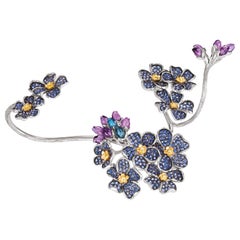 Bracciale a mano firmato con fiori di zaffiro blu