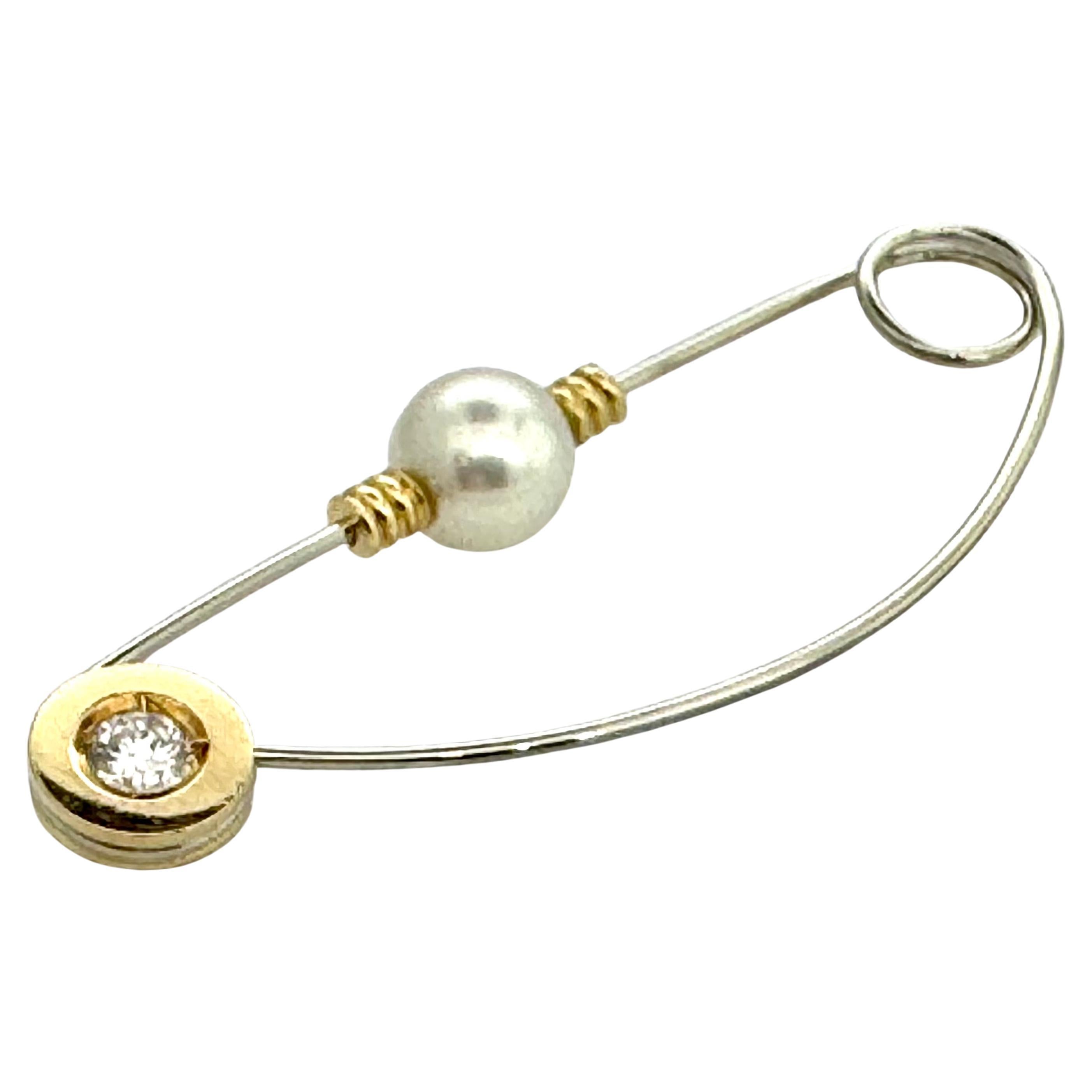 Designer hand made 18 carat gold pin/brooch with diamond and pearl