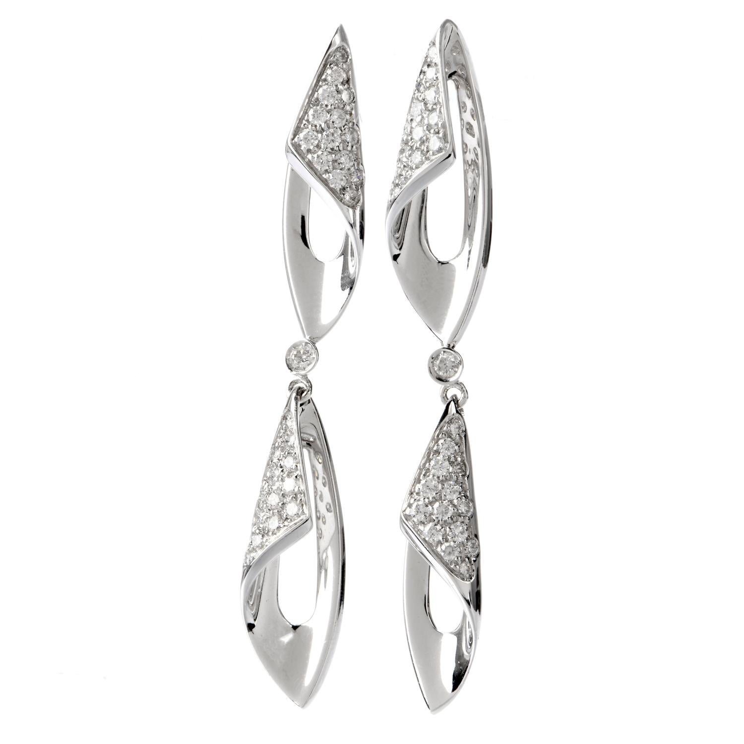 These elegant and glistening Evening Wear Earrings were inspired as a Split

Curving Dangle and crafted in 18K White Gold.

2 Curving pave DIamond links are connected centrally

by a single bezel set Diamond.

Diamonds weigh appx. 1.00 Carat and are