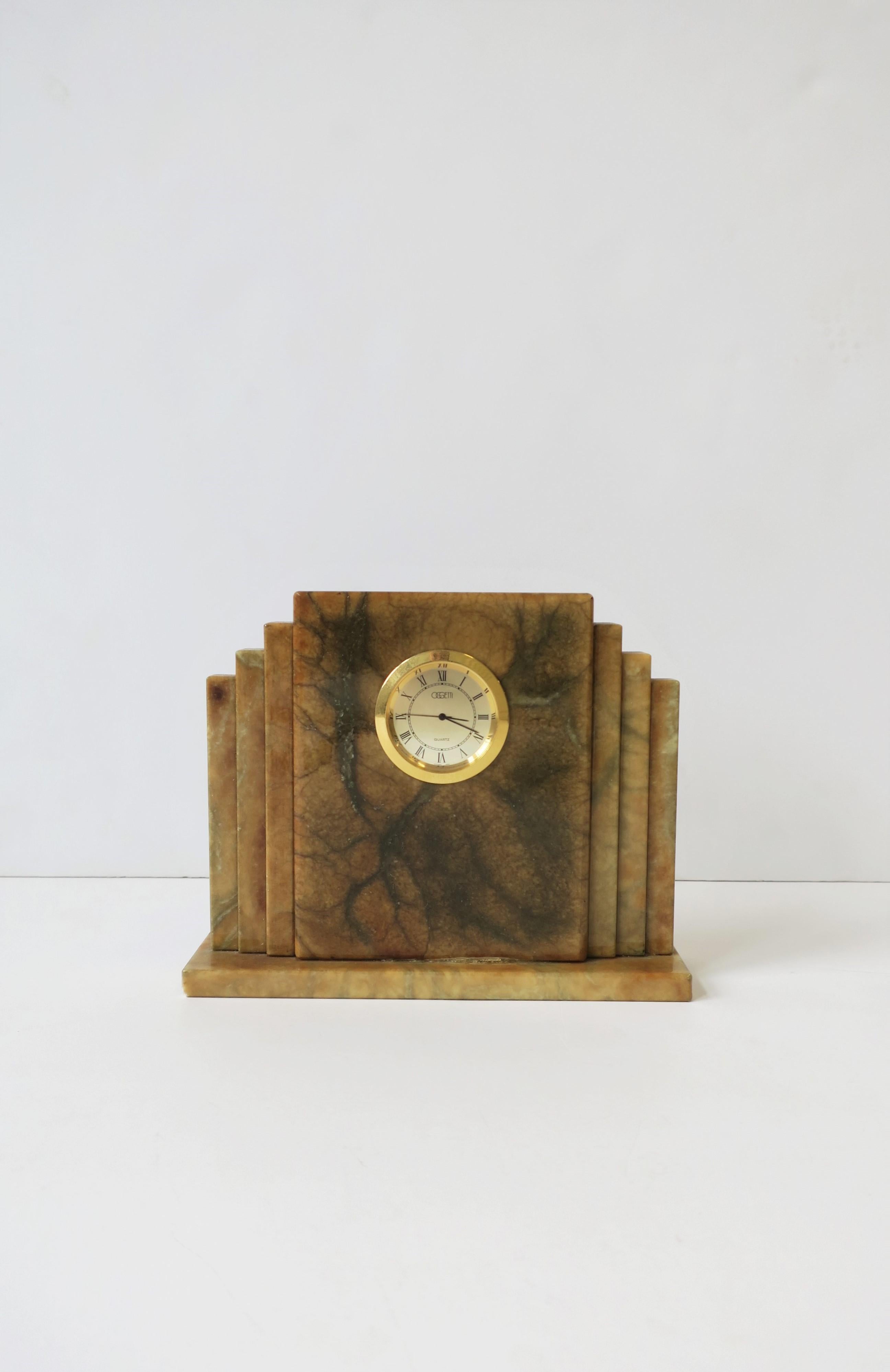 An Italian modern Art Deco mantel, desk, or shelf clock in alabaster marble by Oggetti, Italy, circa 1990s. With maker's mark on bottom as shown in images #14 and 15. Alabaster marble hues includes: cream, gold, brown/tan and dark green. Gold-tone