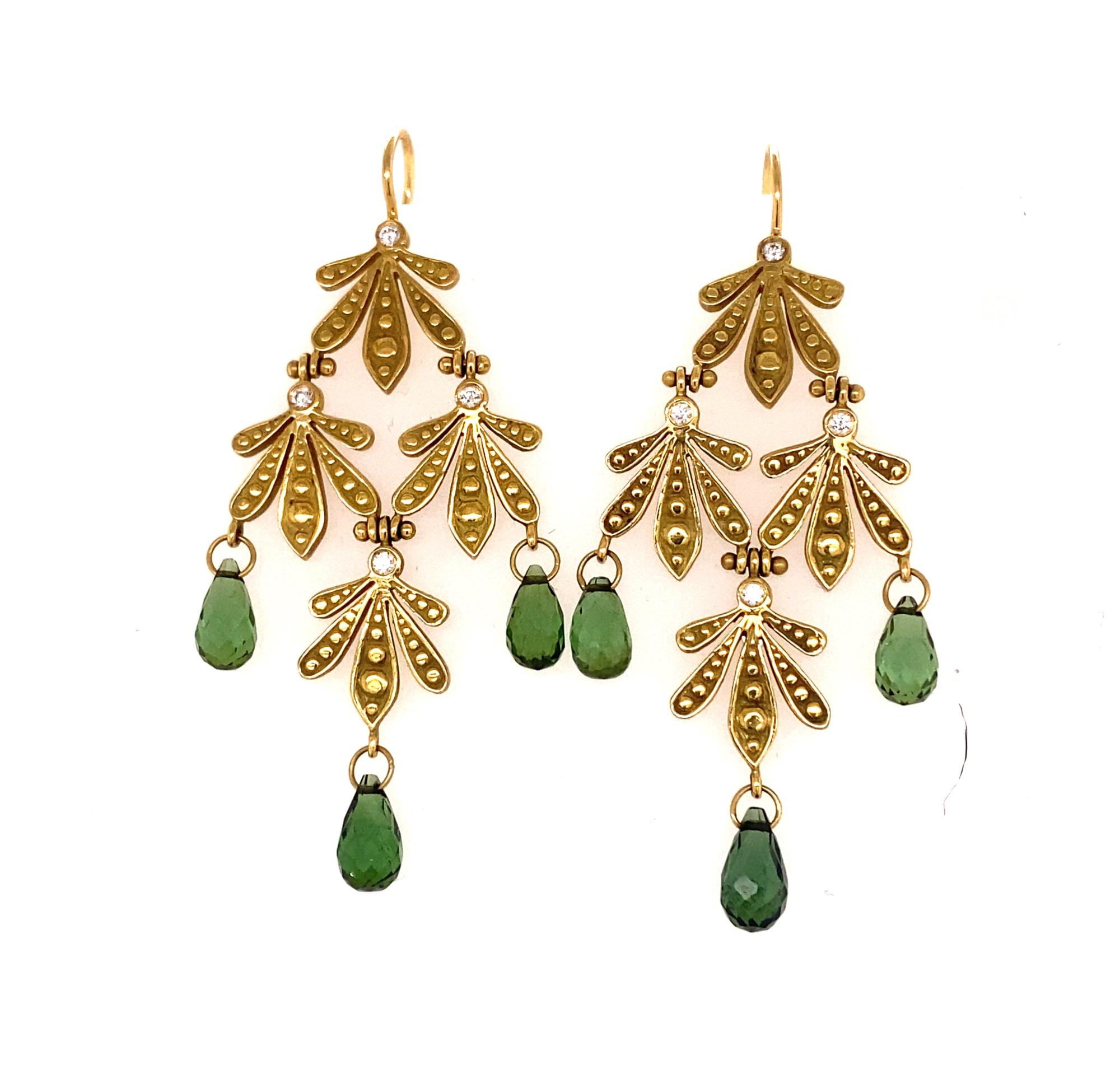This is a stunning pair of dangle earrings by important New York designer Jamie Wolf. The earrings have a natural leaf like design with four moveable sections.  Earrings have 6 briolette cut green tourmalines and 8 diamonds I color VS-2 clarity. 