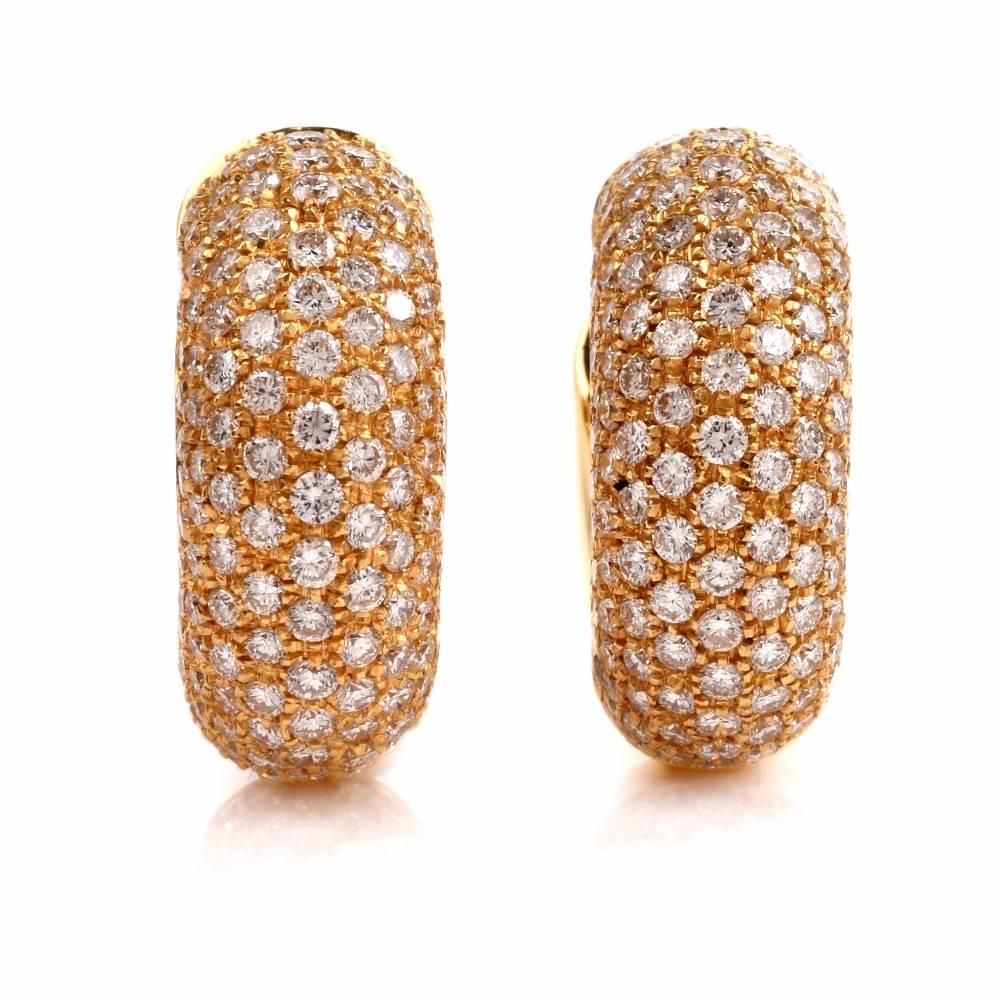 These high quallity italianhuggie earrings are designed an signed  by JD Jewelers, weighing  together 14.4 grams and measuring 19 mm in diameter. The earrings are crafted in solid 18-karat yellow gold and are adorned with carats of pave diamonds
